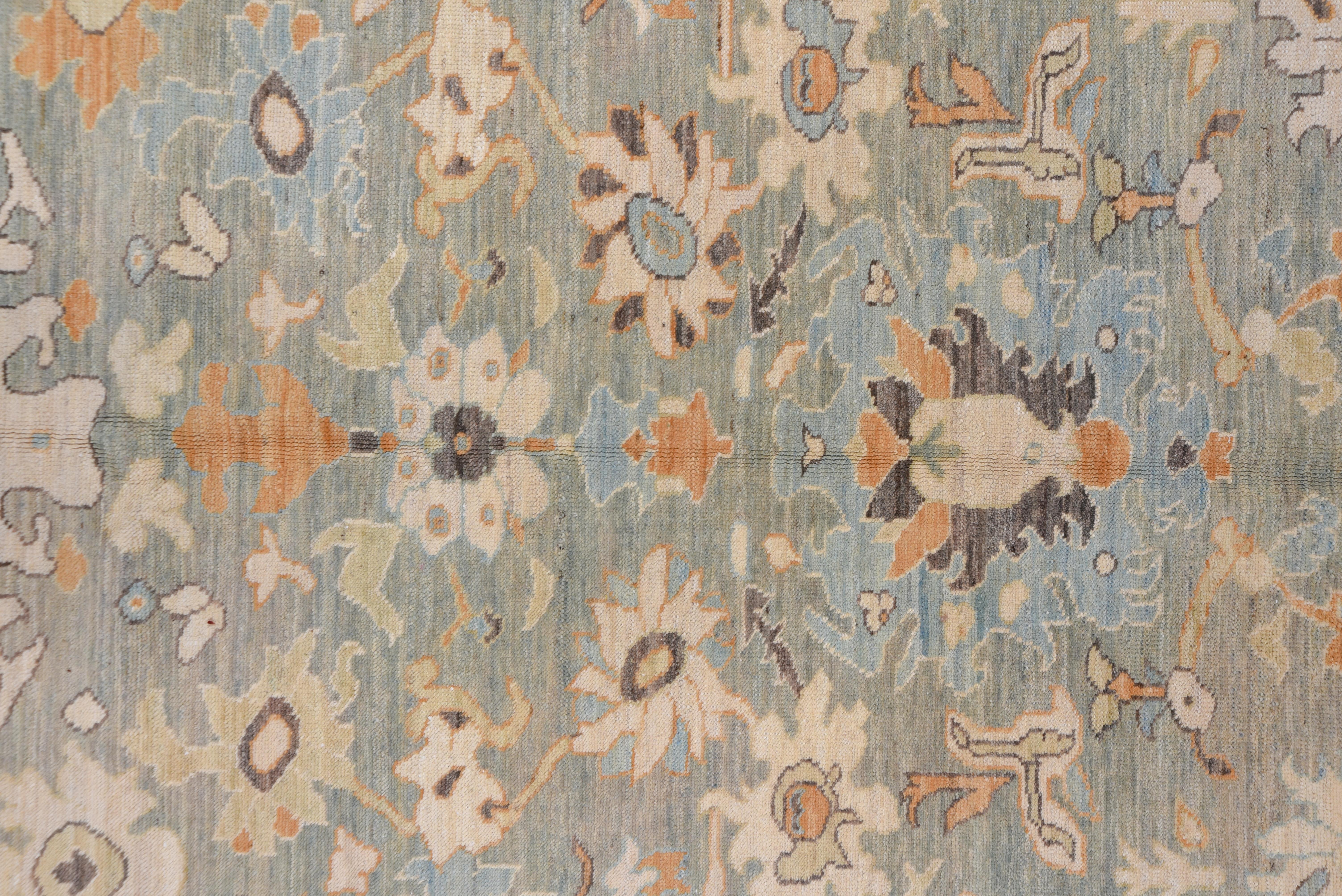 A beautiful combination of neutrals mixed with blues and camels with cream and touches of black make this a perfect foundation for your living or dining room. True to the other range of Oushak style, it has scattered sprays of vine scroll and