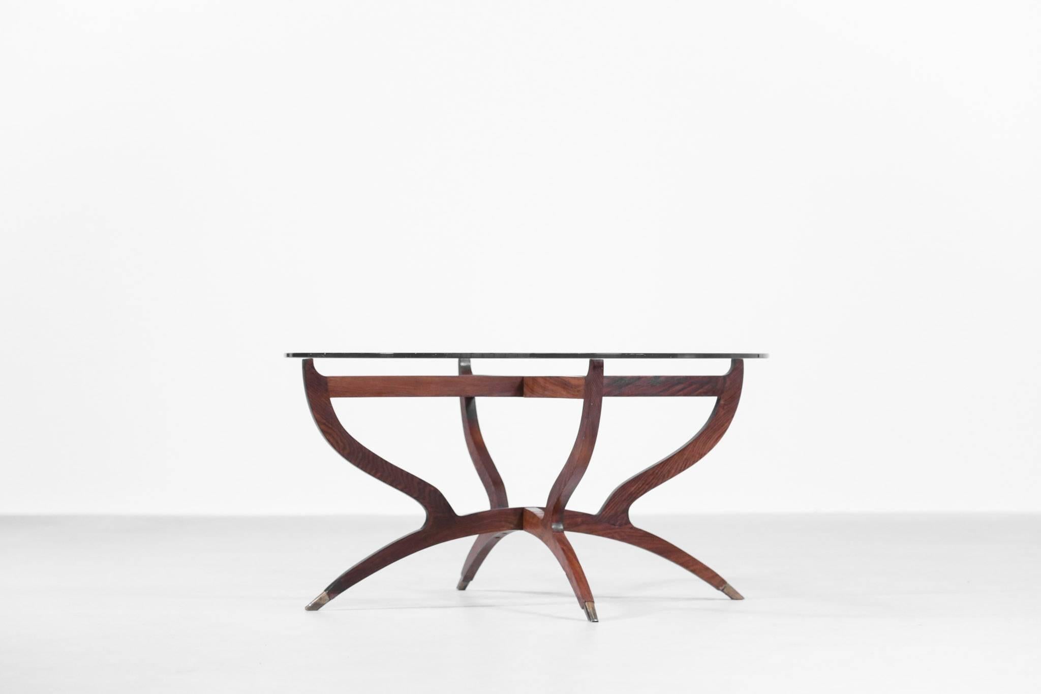 Nice design for this coffee table in the style of Italian designer, Gio Ponti. 
Foldable walnut frame with glass on the top.