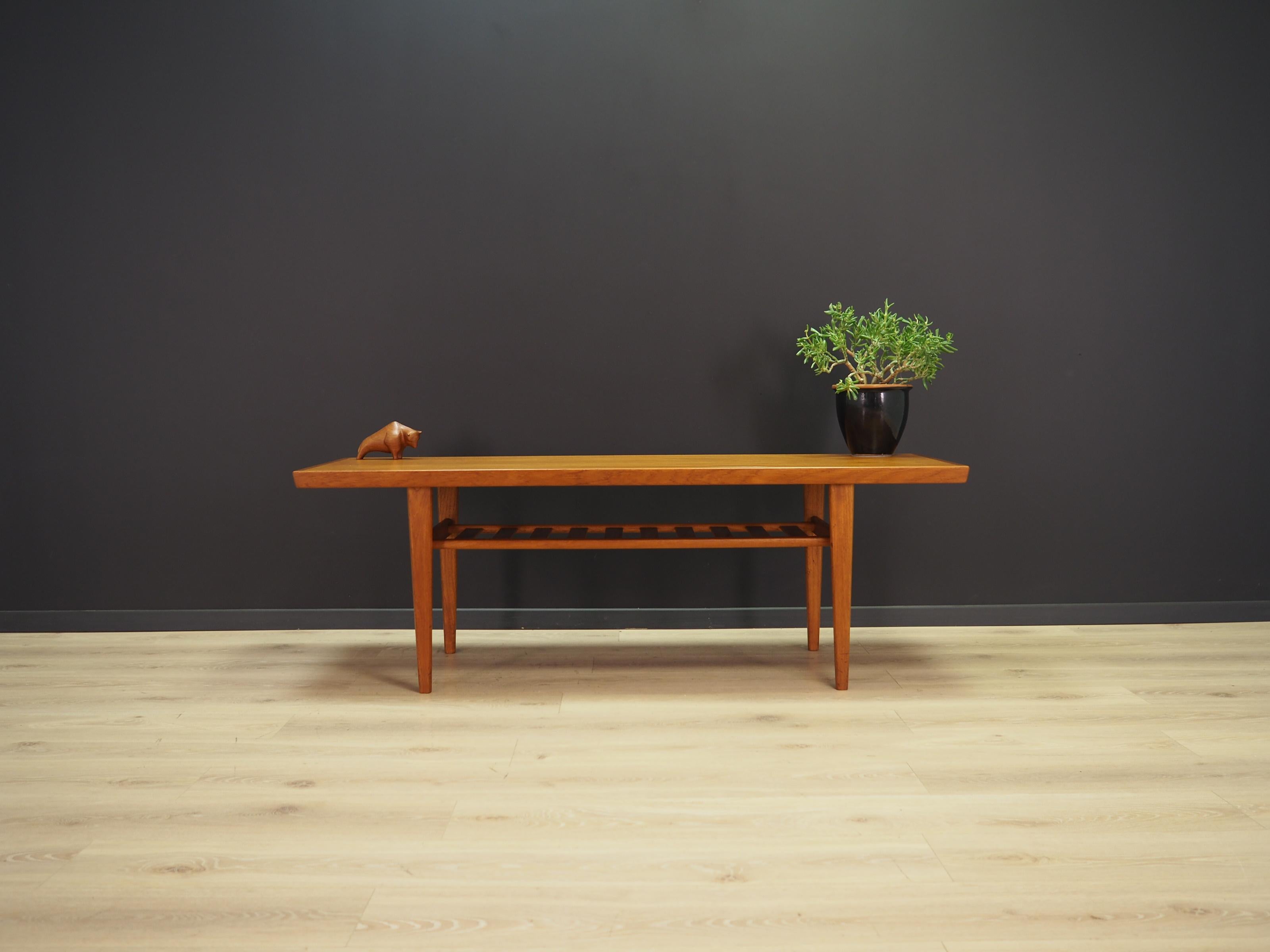 Fantastic coffee table from the 1960s-1970s. Danish design, Minimalist form. Tabletop finished with teak veneer, construction made of solid teak wood. Maintained in good condition (minor bruises and scratches), directly for use.

Dimensions: