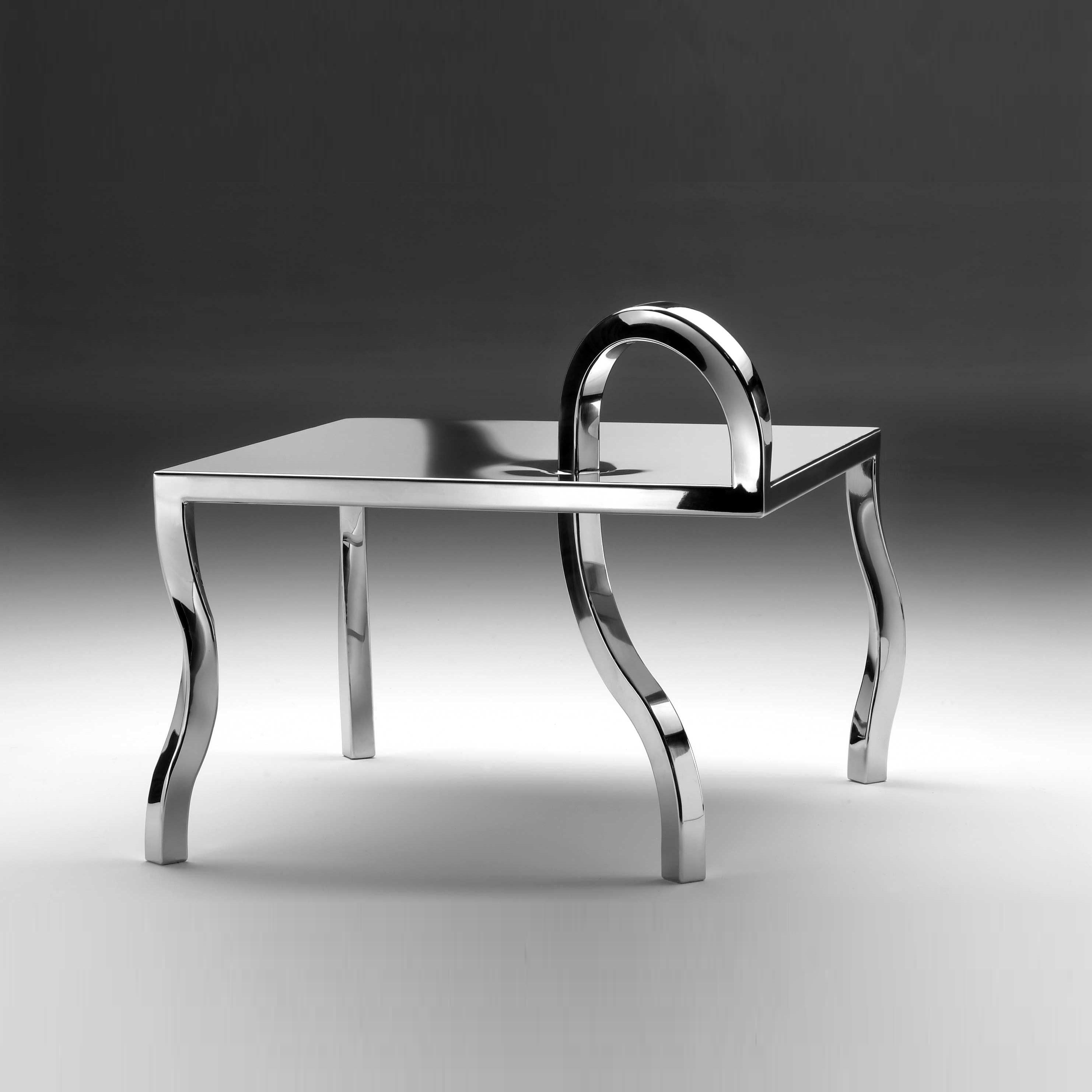 Coffee table - Anomalie Collection designed by Gio Minelli
Materials: Steel
Dimensions: 60 x 60 x h 40 cm

Collection made of polished stainless steel, handmade.
All these pieces have a common character: the curved, twisted legs. An idea of