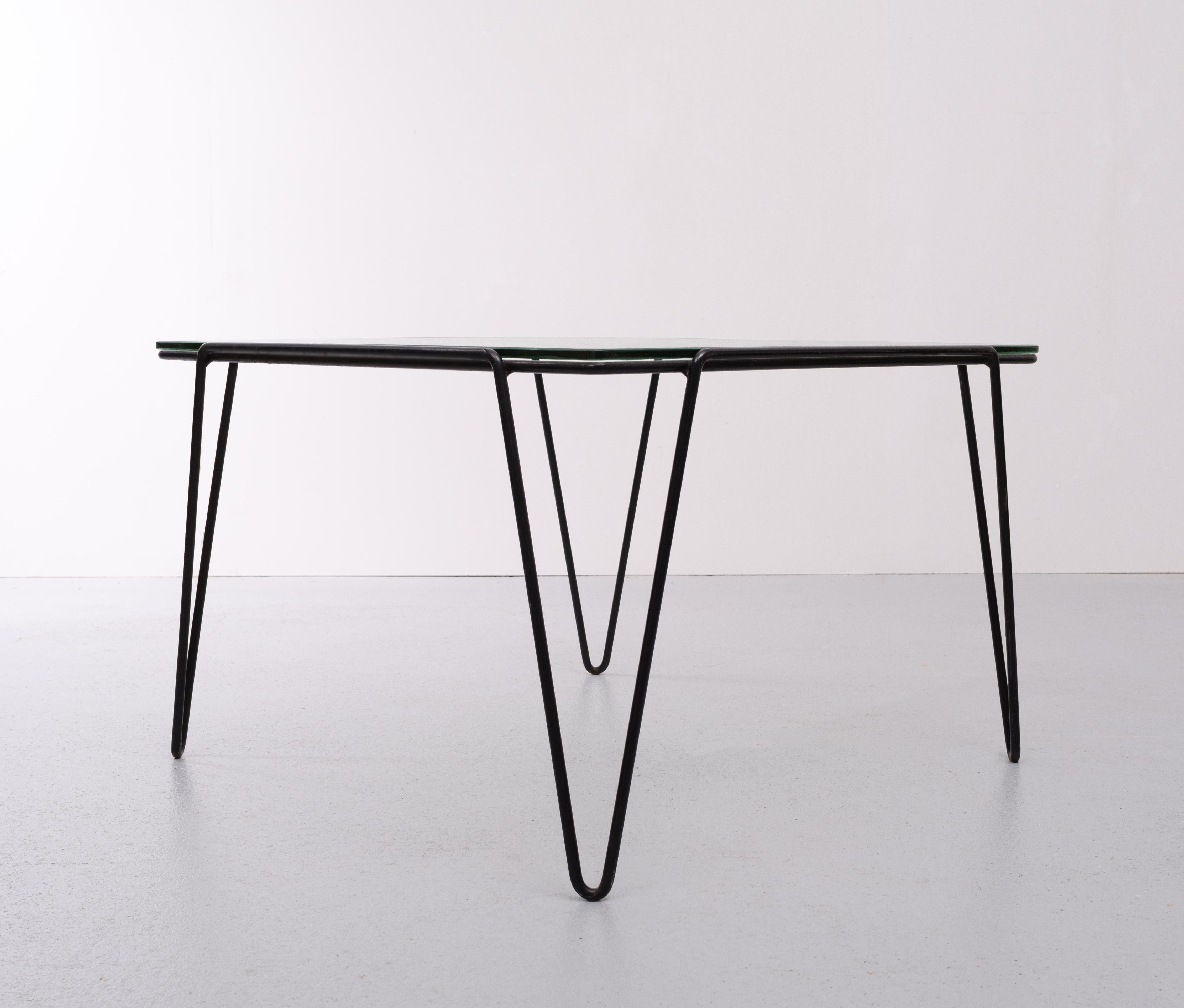 Beautiful square coffee table. Black metal hairpin base, comes with the original clouded glass top
Dutch fifties industrial design Designer: Arnold Bueno de Mesquita
Manufacturer: Groos Holland.
 
