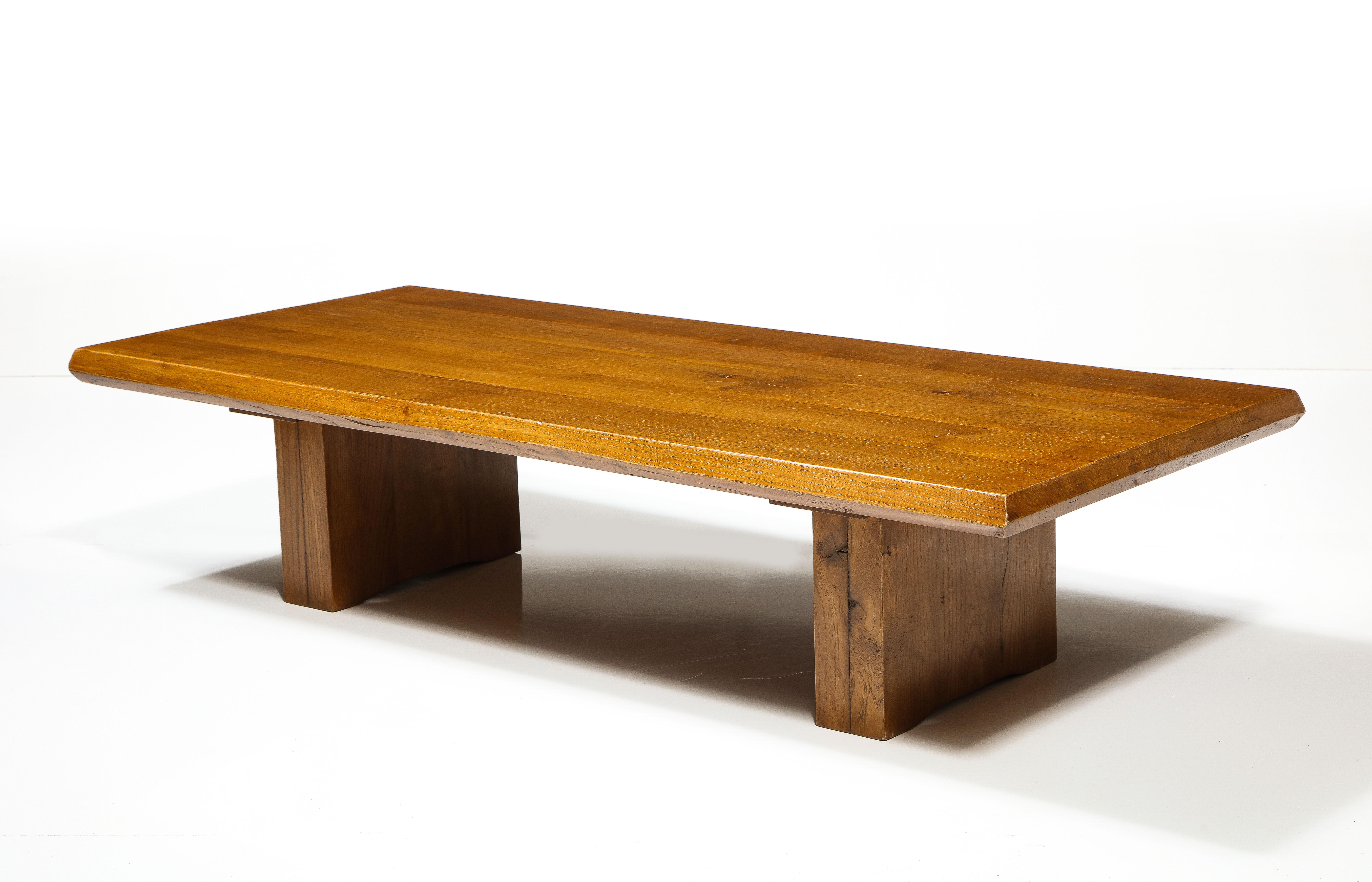 Coffee Table Attributed to Charlotte Perriand, France, c. Mid-20th Century.

Simple yet sophisticated coffee table consists of a solid hardwood construction, sizeable rectangular top, and handsome plinth feet typical of acclaimed French architect