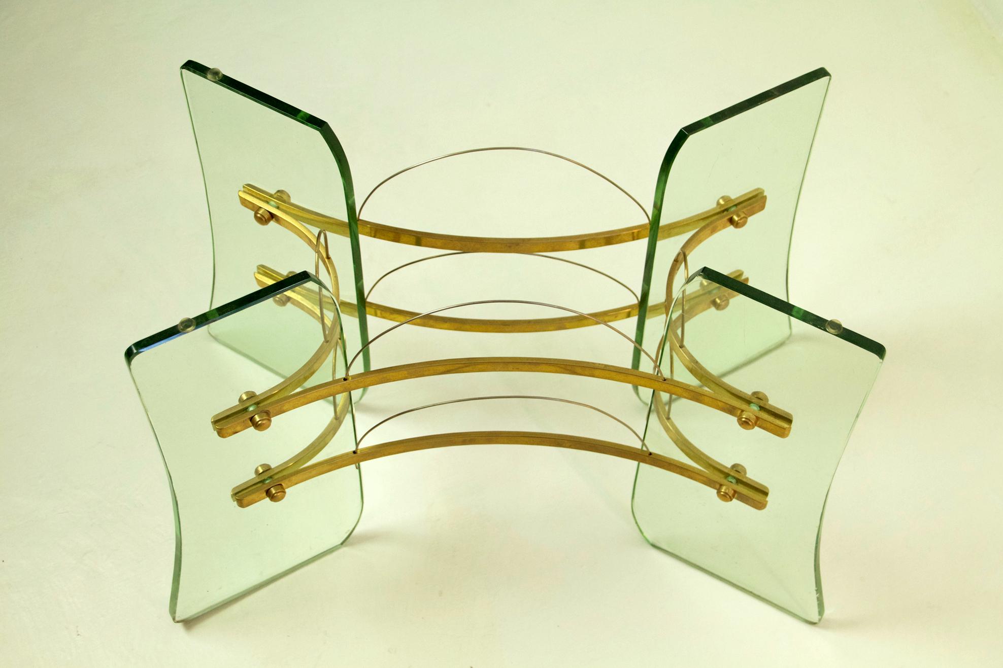 Elegant midcentury coffee table attributed to Pietro Chiesa for Fontana Arte in glass and brass. The glass has a slightly green hue which was typical for Fontana Arte. No chipping or damages.