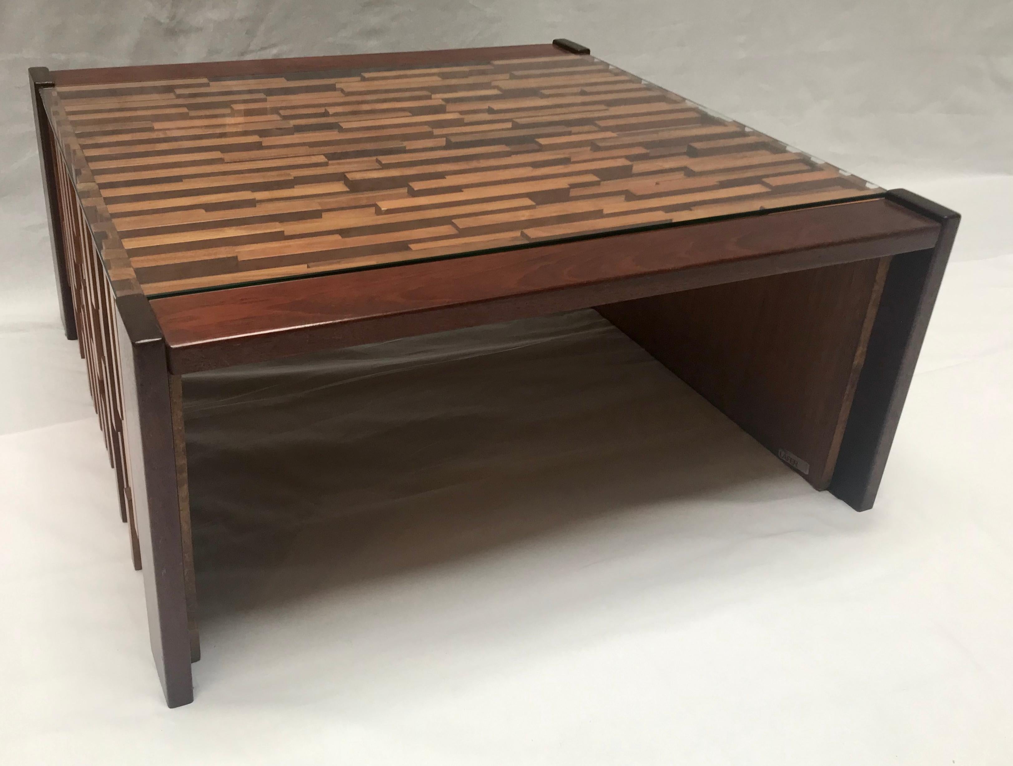 Percival Lafer, coffee table, glass top.

Brazilian hardwood and mahogany,

circa 1970.