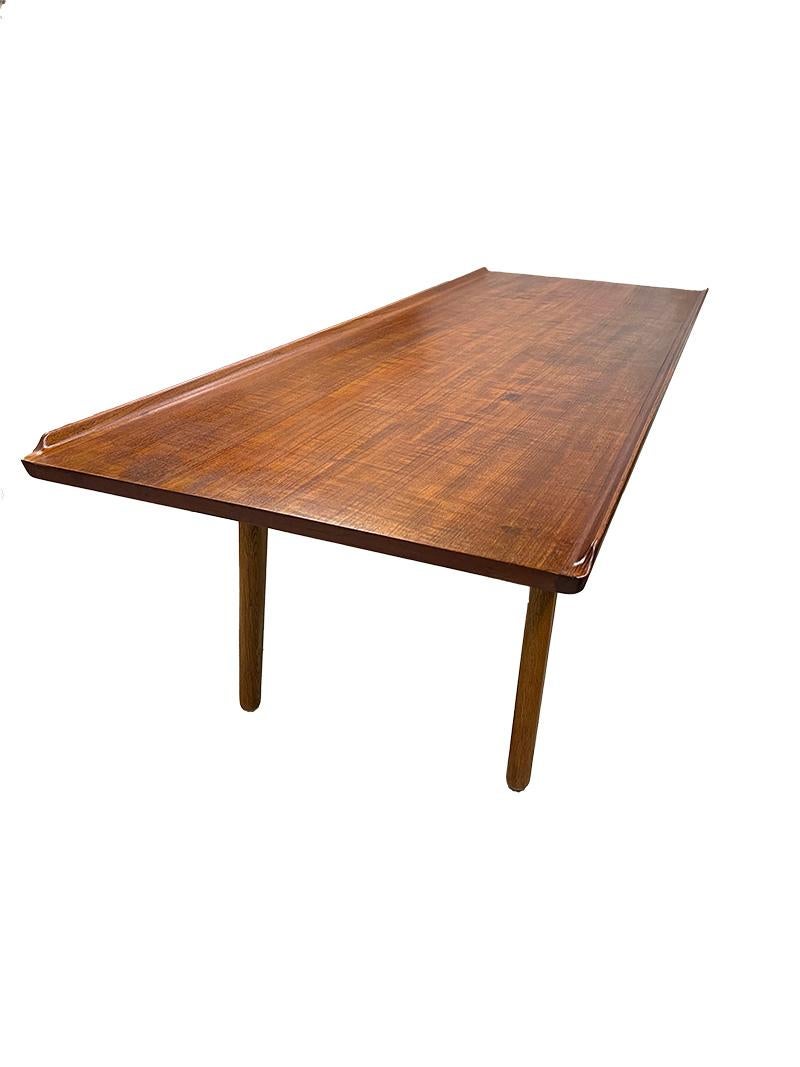 Coffee table by Aksel Bender Madsen for Bovenkamp, ​​1950s

A low elongated coffee table made of teak with organic raised edges on the sides. The base made of oak in the shape of a boomerang. Designer Aksel Bender Madsen (Danish) for Bovenkamp (The