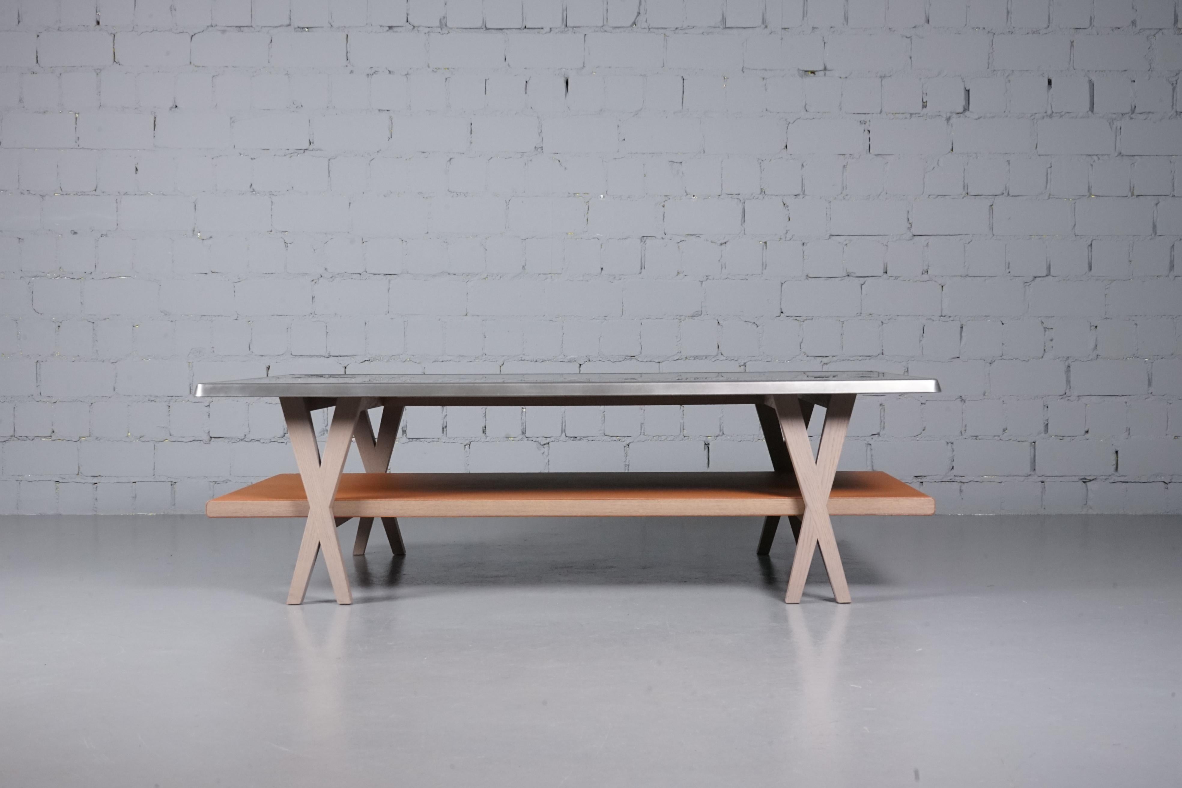 Large modern coffee table designed by the Italian architect and designer Antonio Citterio for Hermès Paris.

The table has a solid oak frame. A metal top and a second oak top covered with finest leather. 

The table is marked “Hermès Paris Italy” on