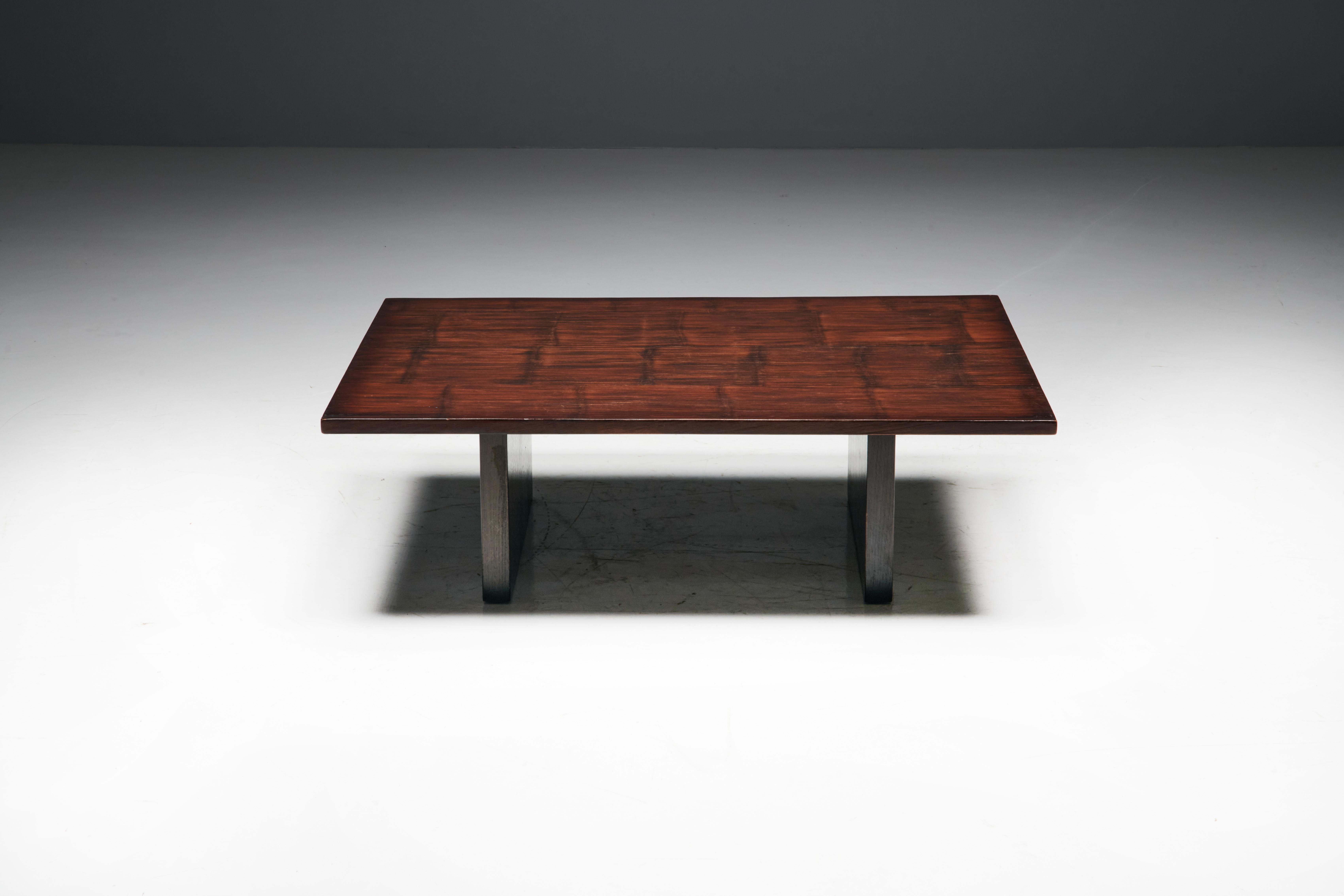 Coffee table by Axel Vervoordt, a visionary Belgian decorator and art dealer. Crafted in the 1980s, this exceptional piece showcases Vervoordt's unparalleled design prowess. Constructed with a combination of rich wengé wood and bamboo, this coffee