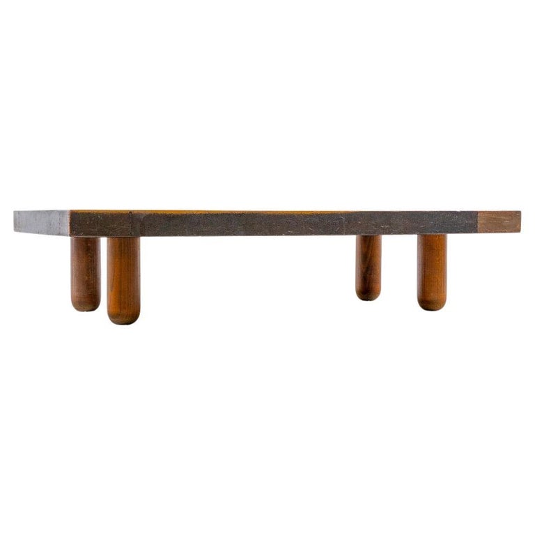 Coffee table on conical wooden legs and rectangular nailed metal surface. Stamped 