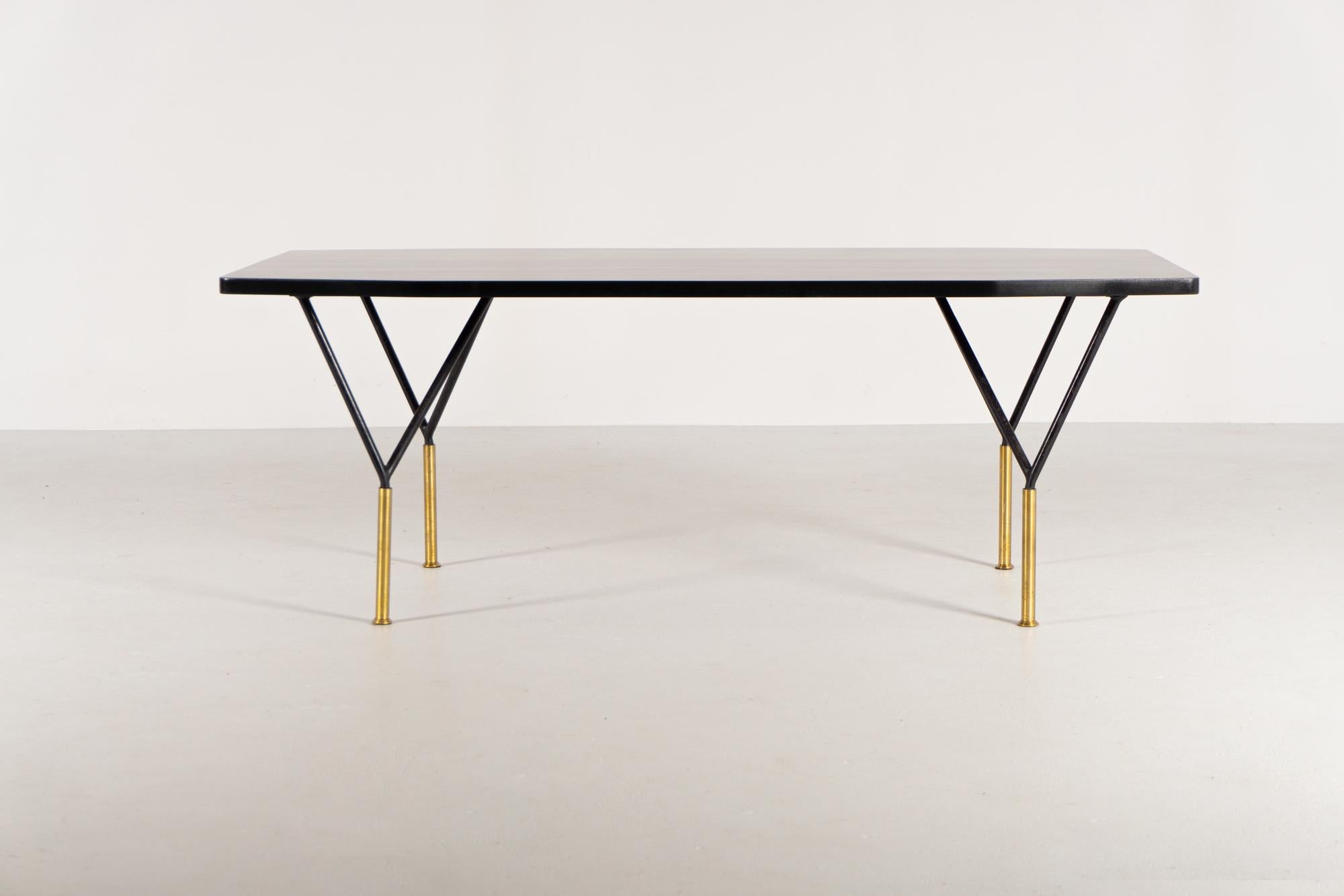 Elegant Coffee-Table (Model 755) by Italian architect and designer Carlo de Carli.

Ash wood table top, stained and lacquered black,  black-lacquered metal construction and brass

Reference:
Esempi, Tavoli Tavolini Carrelli,Seconda Serie, Hoepli,