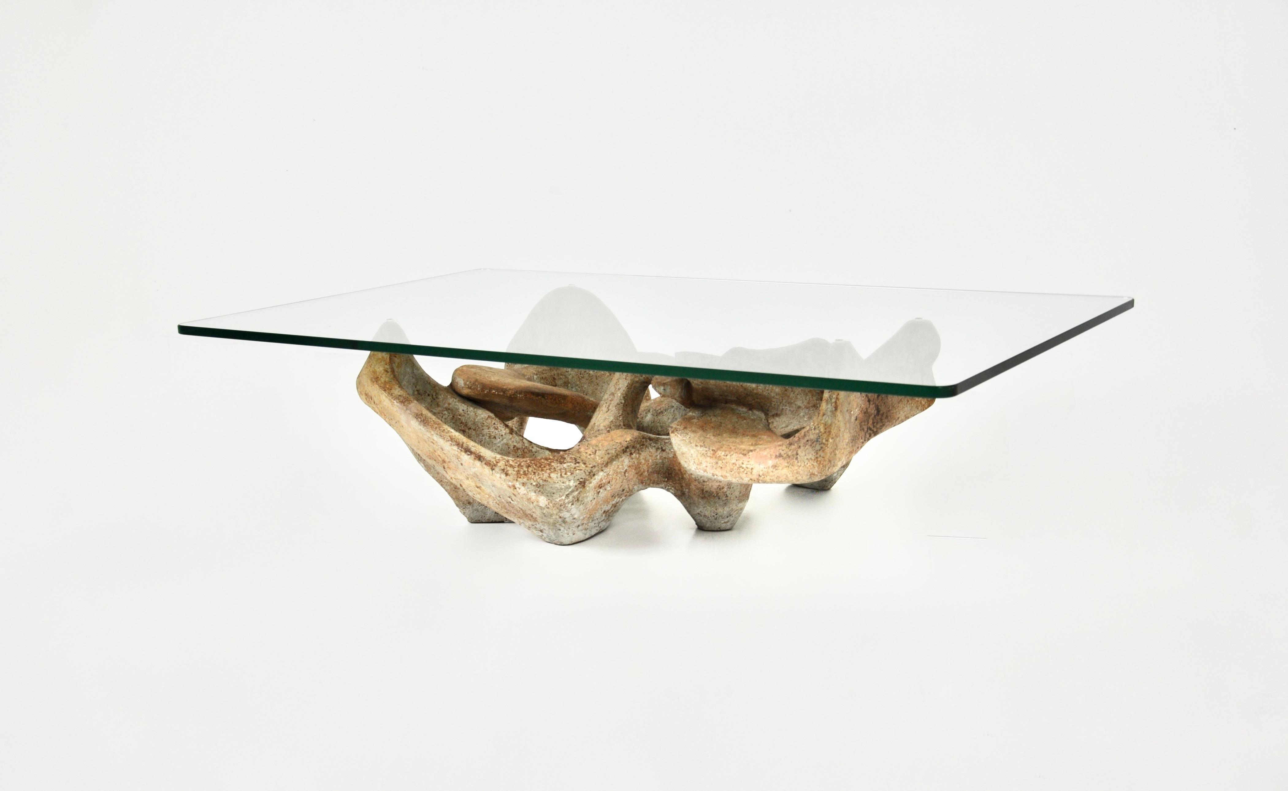 Coffee table with glass top and sculpted concrete base by Claudio Trevi in the 70s. Wear due to time and age of the coffee table