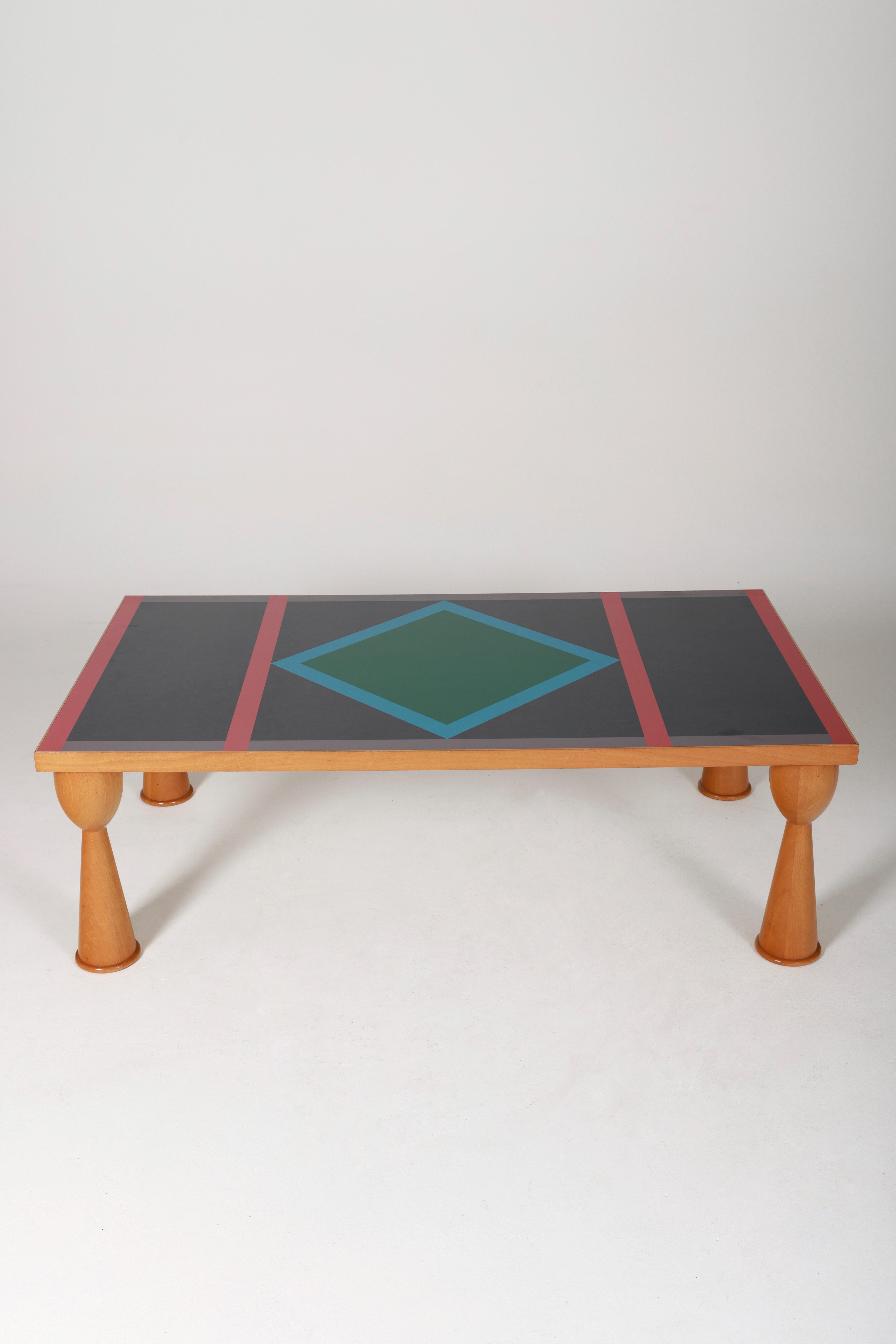 Alicudi coffee table by the designer Ettore Sottsass (1917-2007) and Marco Zanini for the publisher Zanotta, from the 1990s. Wooden table with polychrome geometric patterns. In very good condition.
LP926