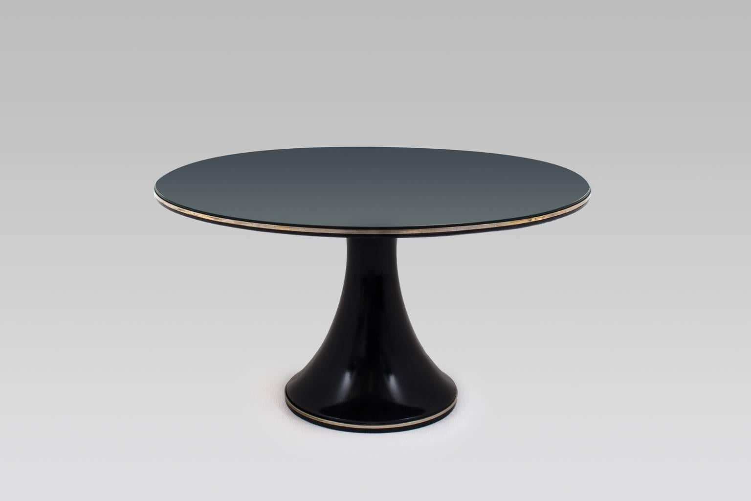 Rare exclusive coffee table by Fontana Arte, Italy, 1960s. The table comes from a very good house in Milan and was purchased in 1968. Beautiful dark grey / blueish colored mirror (exclusively used by Fontana Arte) on a trumpet shaped solid wooden