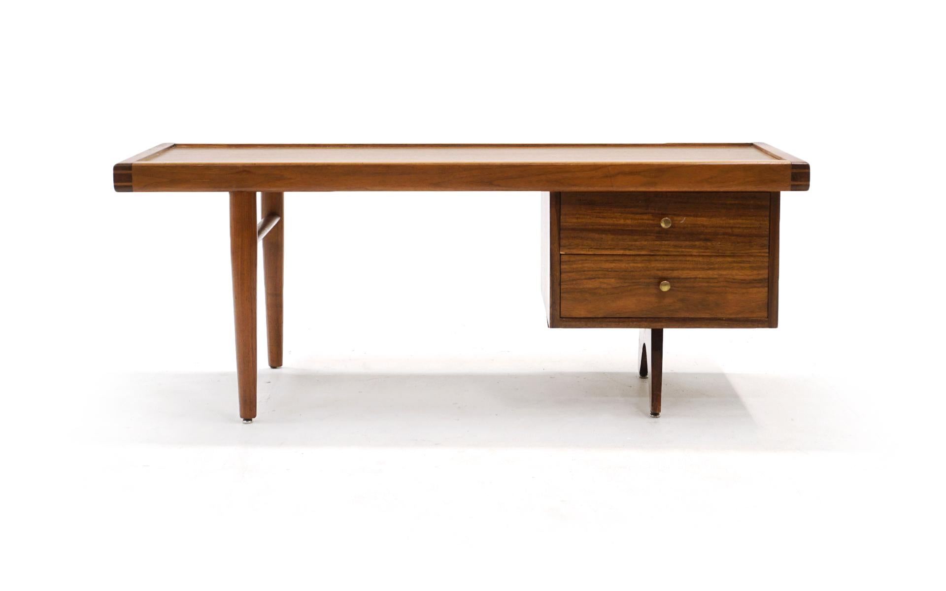 Rectangular coffee table model 217 designed by George Nakashima for his origin / origins series for Widdicomb, 1950s, in Sundra (meaning thing of beauty) finish.  Beautifully figured East Indian laurel wood with the original brass pulls and glass