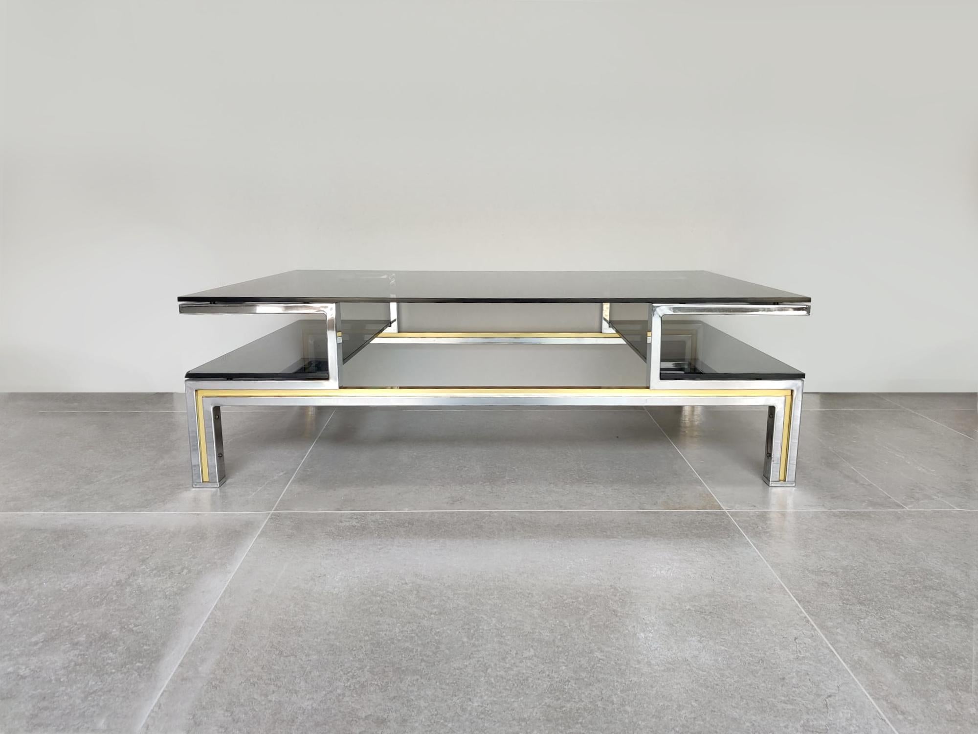 Spectacular center table in chromed metal and brass, with three smoked glasses attributed to the design of Guy Lefevre for Maison Jasen.