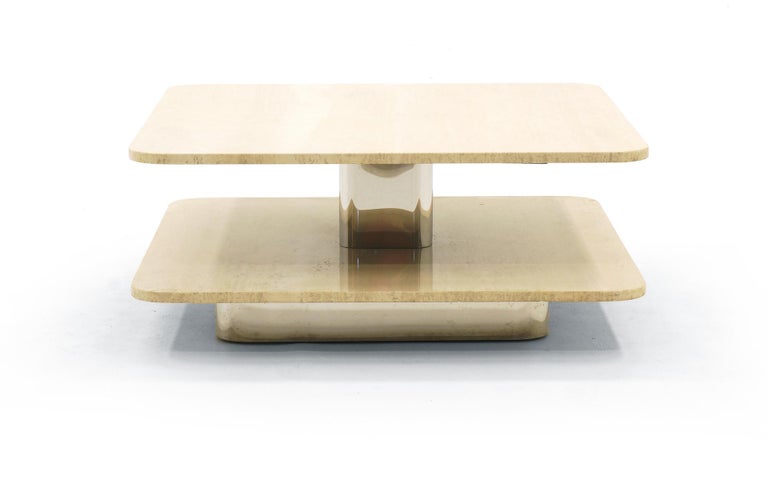 Travertine top square coffee table in the style of Harvey Probber. 36 inch square polished travertine with rounded corners. Recessed chrome base and chrome pedestal center.