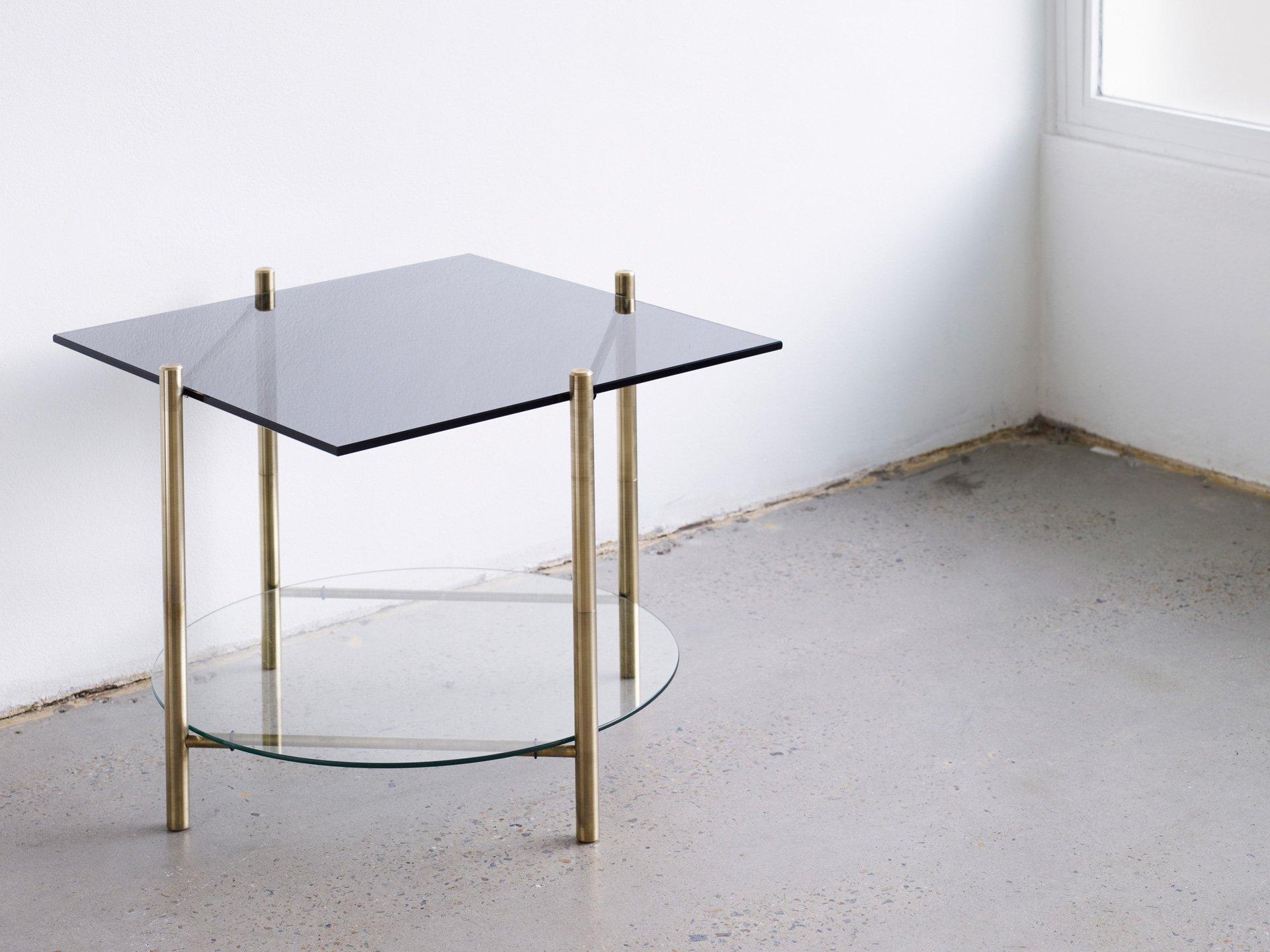 Coffee table by Henry Wilson
Square table/round table

Solid brass frame with two-tiered surfaces. All the tables are made to order in client specified materials. Some possibilities are; stone varieties, timbers, clear glass and colored glass, in