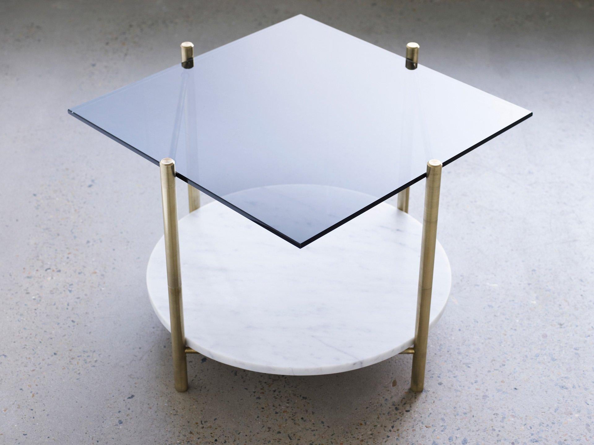 Coffee table by Henry Wilson
Square table/round table

Solid brass frame with two tiered surfaces. All the tables are made to order in client specified materials. Some possibilities are, stone varieties, timbers, clear glass and colored glass, in