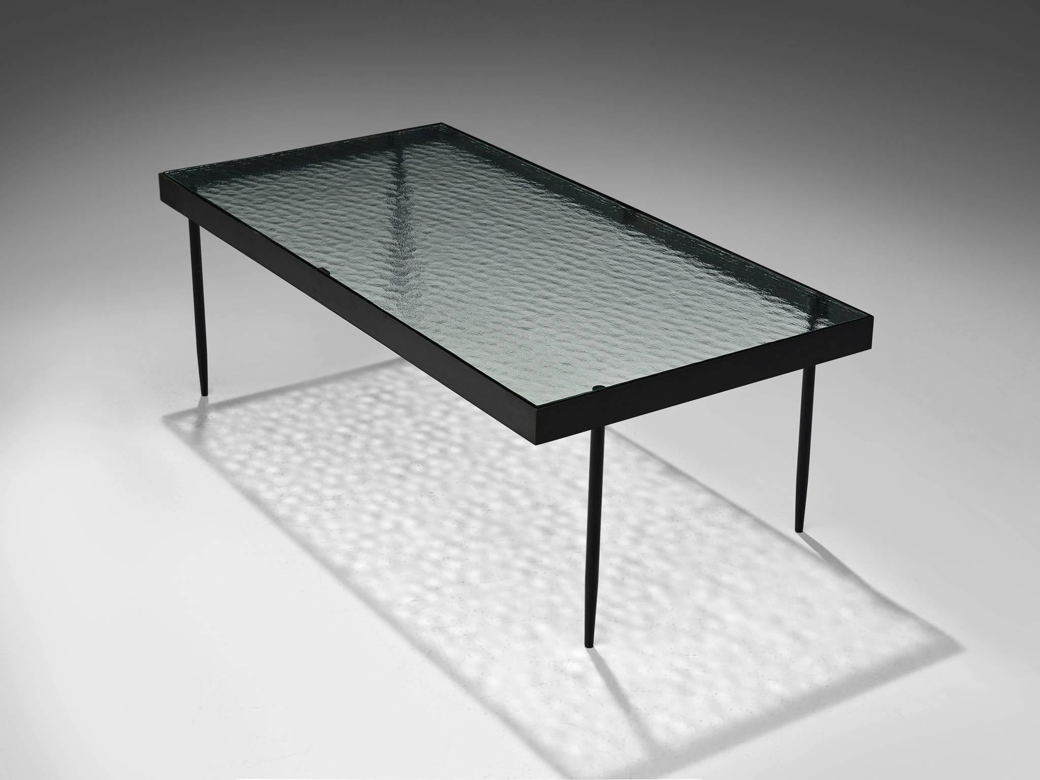 Janni van Pelt for Bas van Pelt, coffee table, glass, metal, Netherlands, 1958. 

This is a rare rectangular coffee table is designed by Janni van Pelt for Bas van Pelt. The table is made from reinforced glass with delicate tapered legs and a black