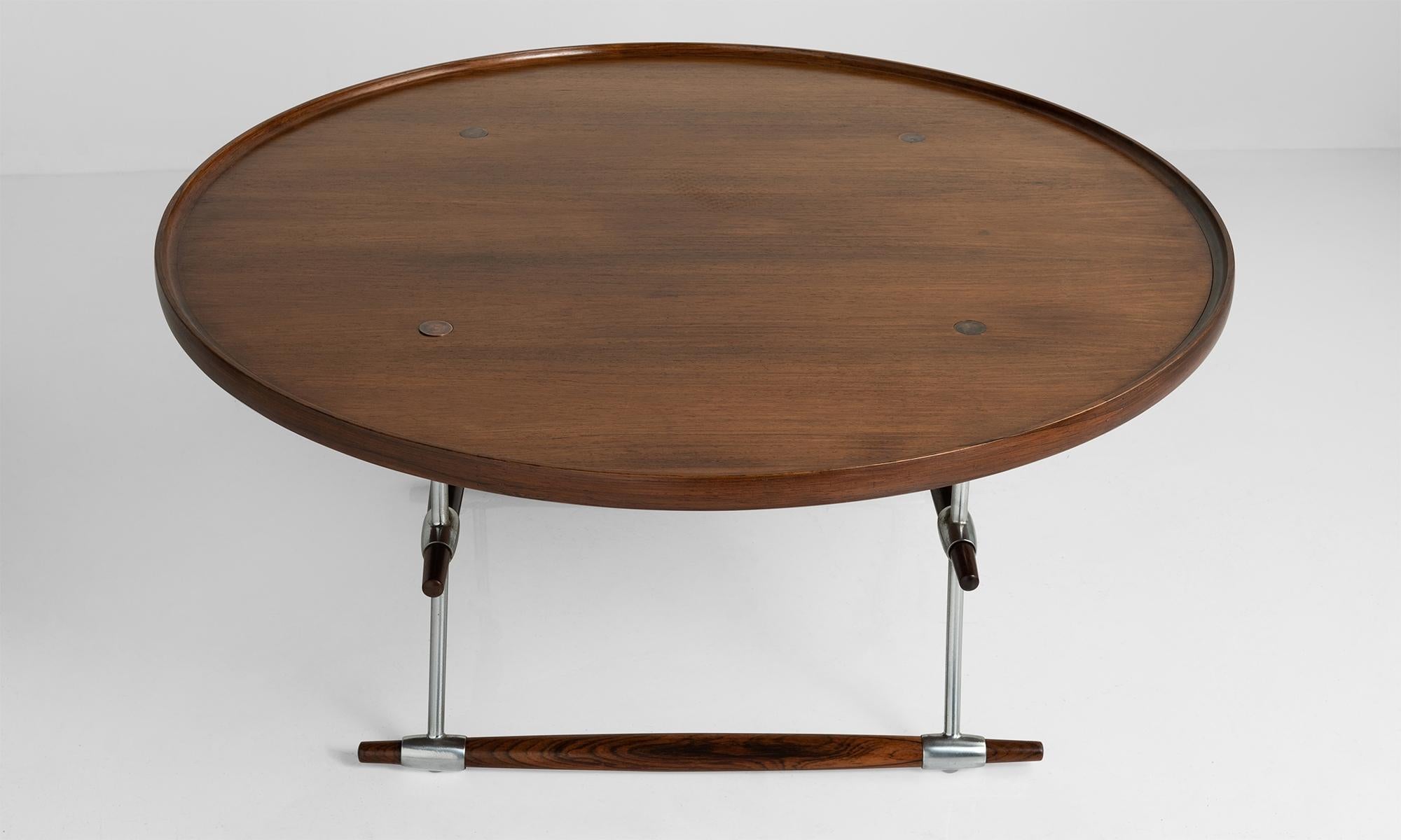 Circular wood and chromed steel table manufactured by Richard Nissen.