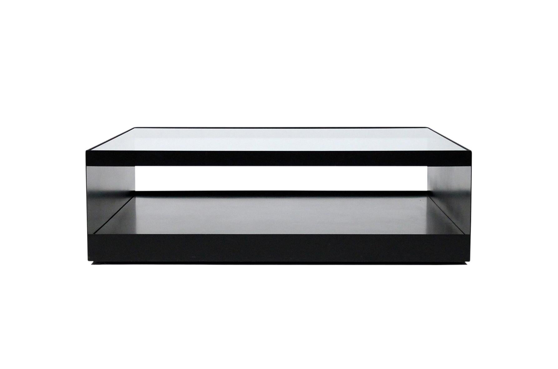 Enameled steel and safety glass coffee table designed by Joe D’Urso for Knoll. This low rolling table is Model 6048T and is from the Minimalist line D’Urso designed for Knoll in the 1980s. Table with original rare black finish.