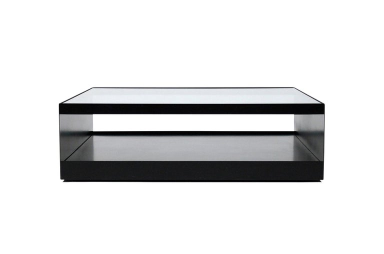 Enameled steel and safety glass coffee table designed by Joe D’Urso for Knoll. This low rolling table is Model 6048T and is from the Minimalist line D’Urso designed for Knoll in the 1980s. Table with original rare black finish.