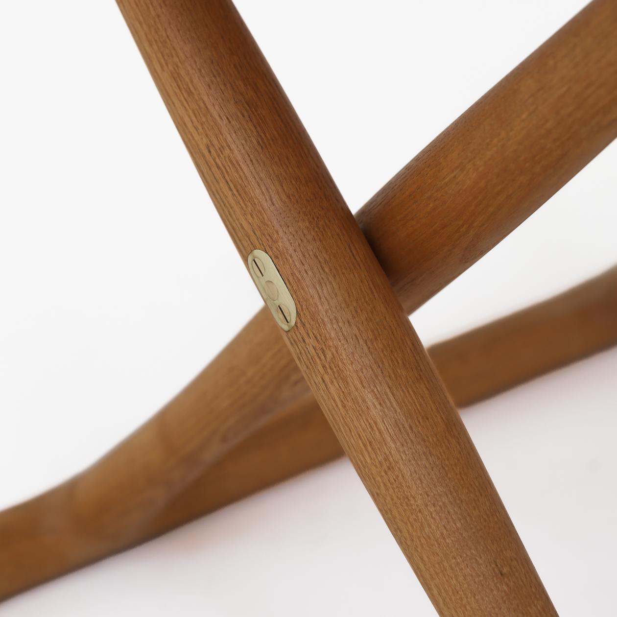 The Egyptian table in ash and brass details. Mogens Lassen / Rud. Rasmussen.
    