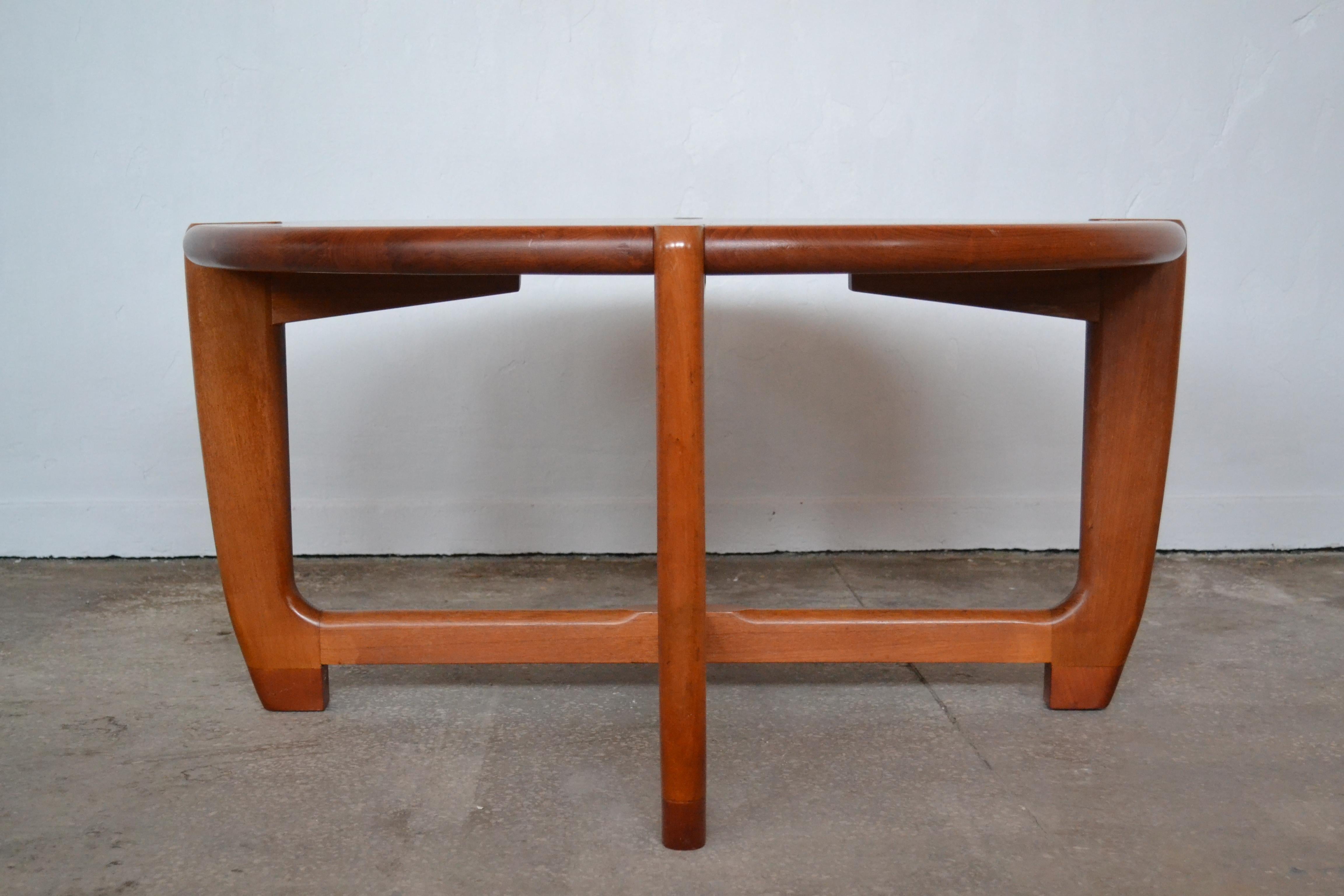 This large solid teak coffee table was designed by Niels Eilersen in the 1960s. The piece remains in a fully original condition without any renovation and has an interesting form.