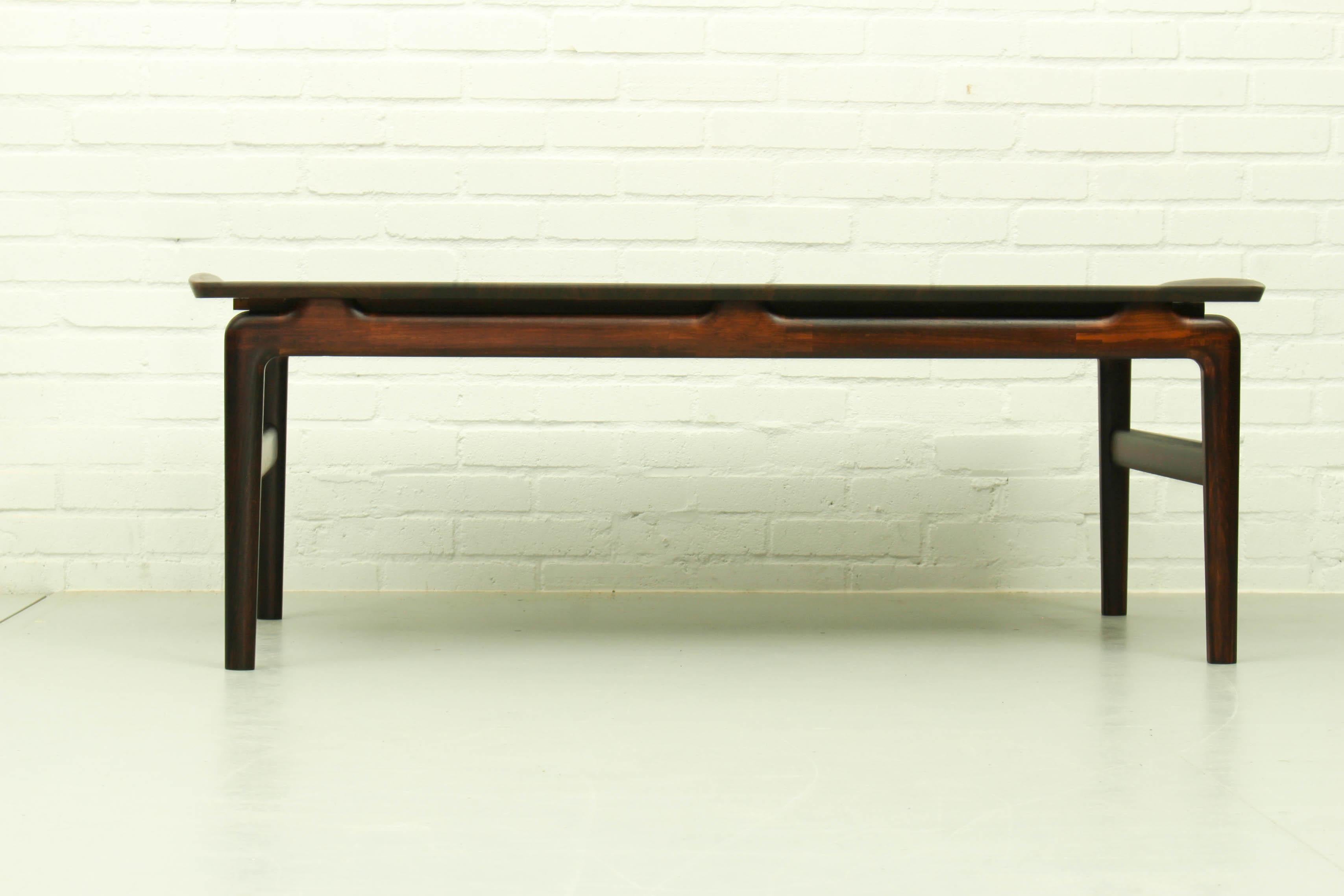Rosewood coffee table designed by Peter Hvidt & Orla Mølgaard-Nielsen for France & Søn, Denmark 1957. The table is made of massive rosewood, extendable with a Formica small table top. 

Dimensions: 122cm L, 44cm H, 54cm W. 

* Please note that