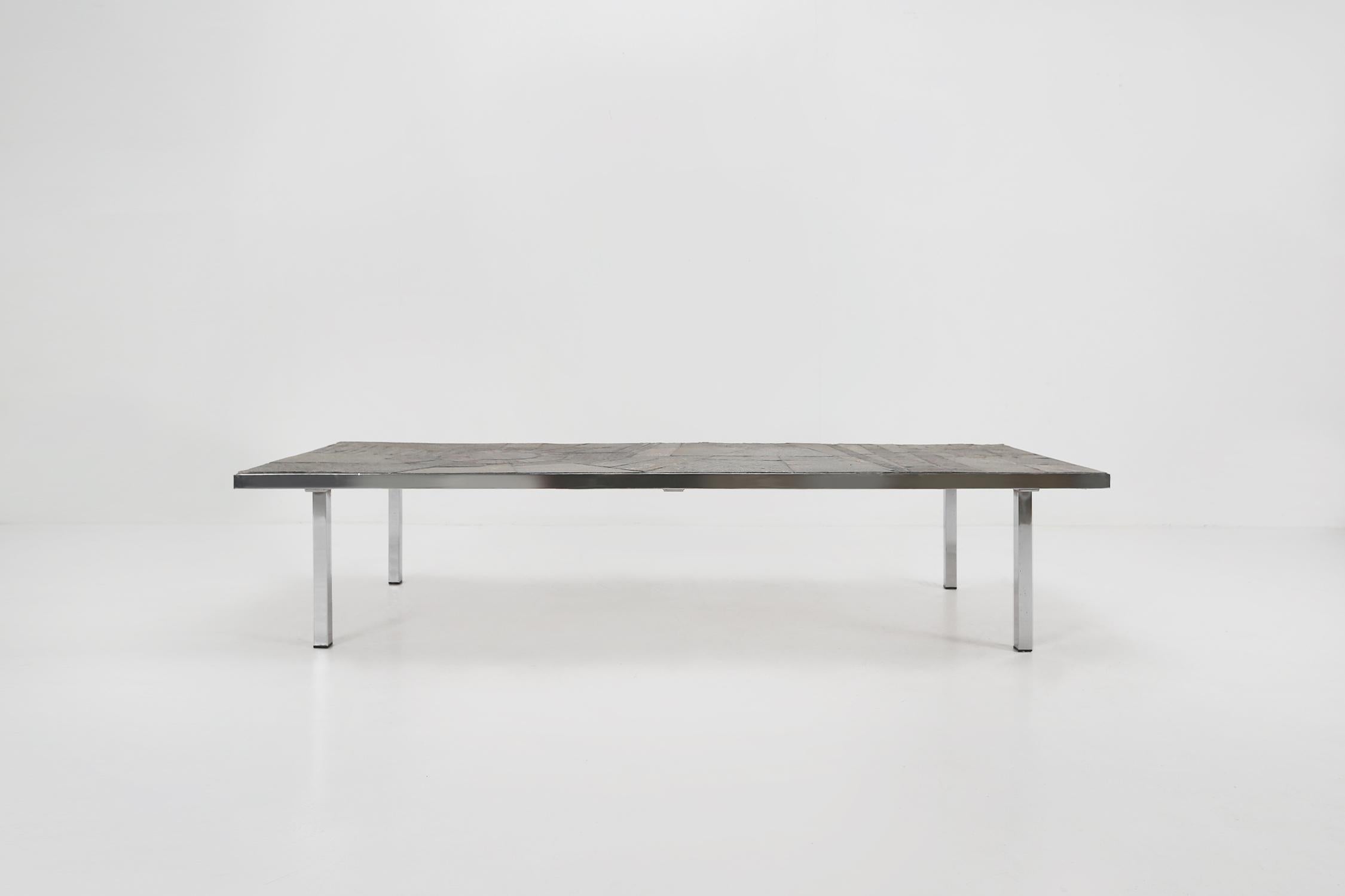 Coffee table by Pia Manu made in Belgium Ca.1960.
Handmade stone top with and chrome base.