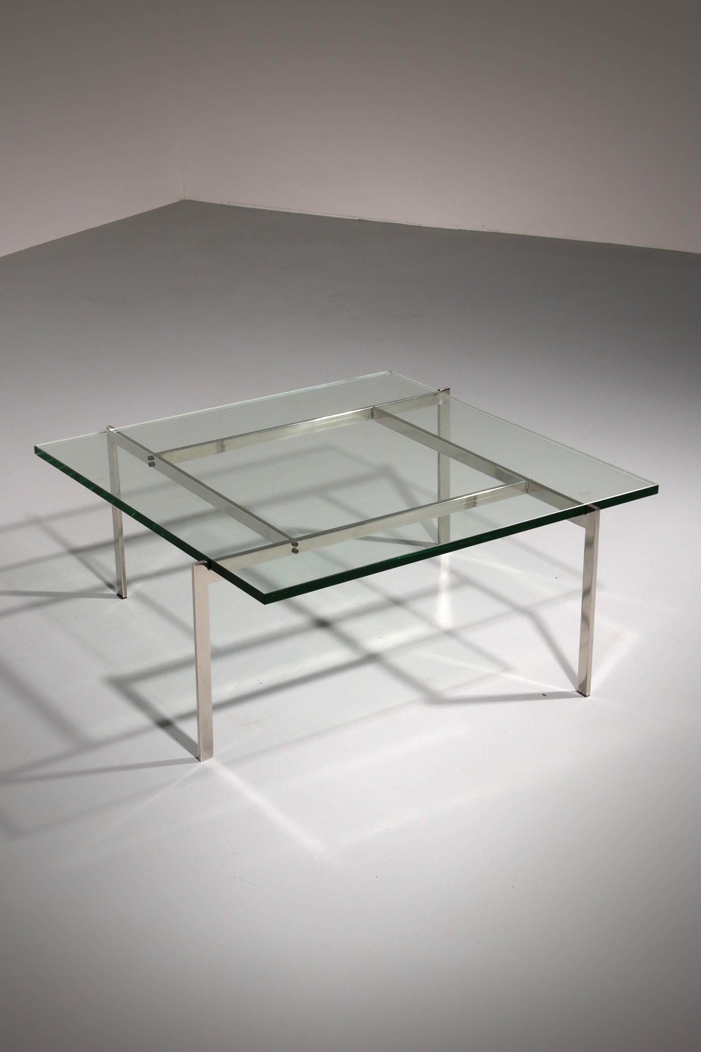 This iconic PK61 coffee table, designed by renowned Danish designer Poul Kjærholm, is a timeless piece produced by Fritz Hansen. A perfect example of minimalist elegance, the table features a sleek, industrial-inspired base in steel paired with a