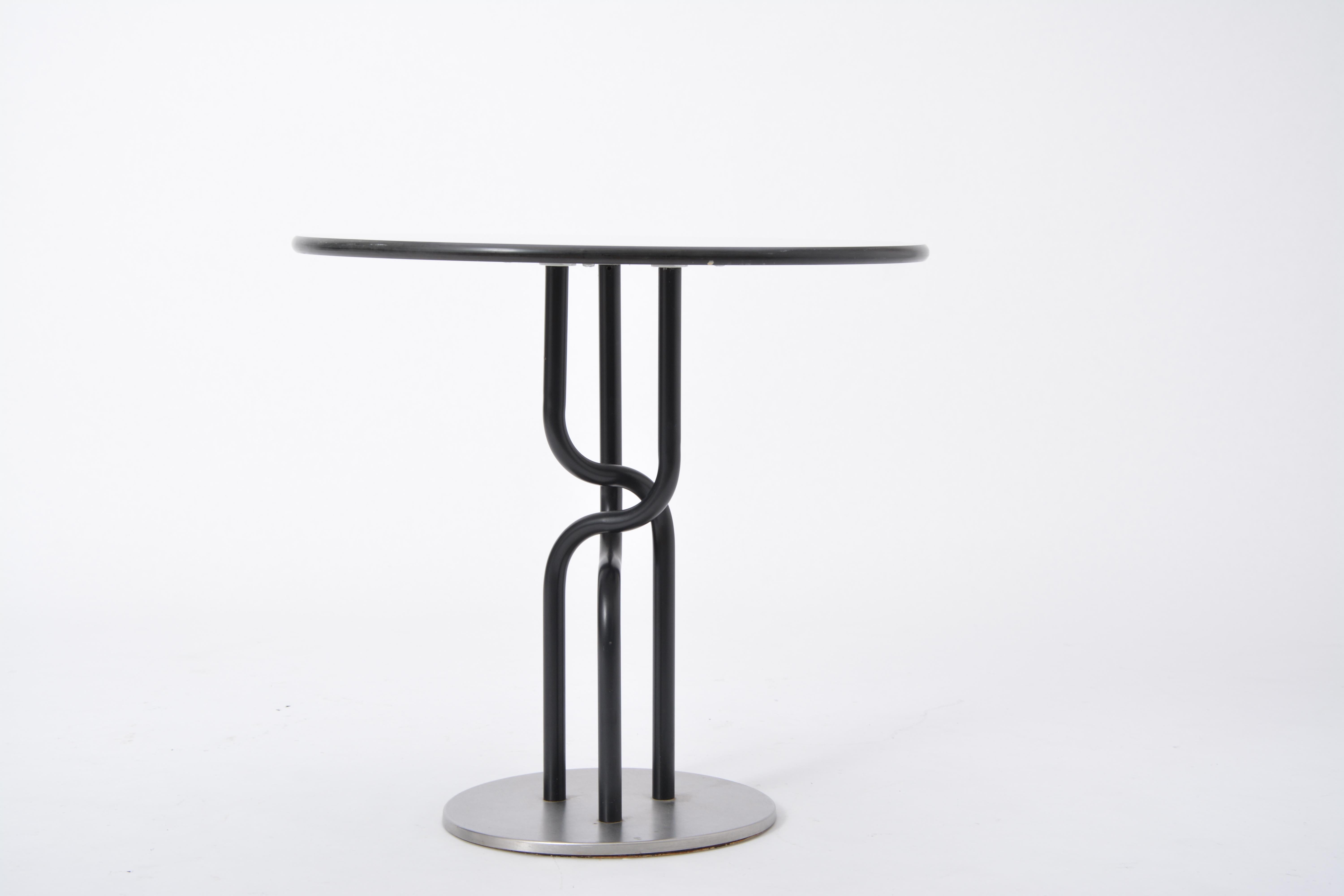 Danish Post-Modern side table by Rud Thygesen and Johnny Sorensen for Botium
- Round coffee table designed by Rud Thygesen and Johnny Sørensen
- Produced by Botium in Denmark in 1989
- The table has a white laminate tabletop
- Black lacquered steel