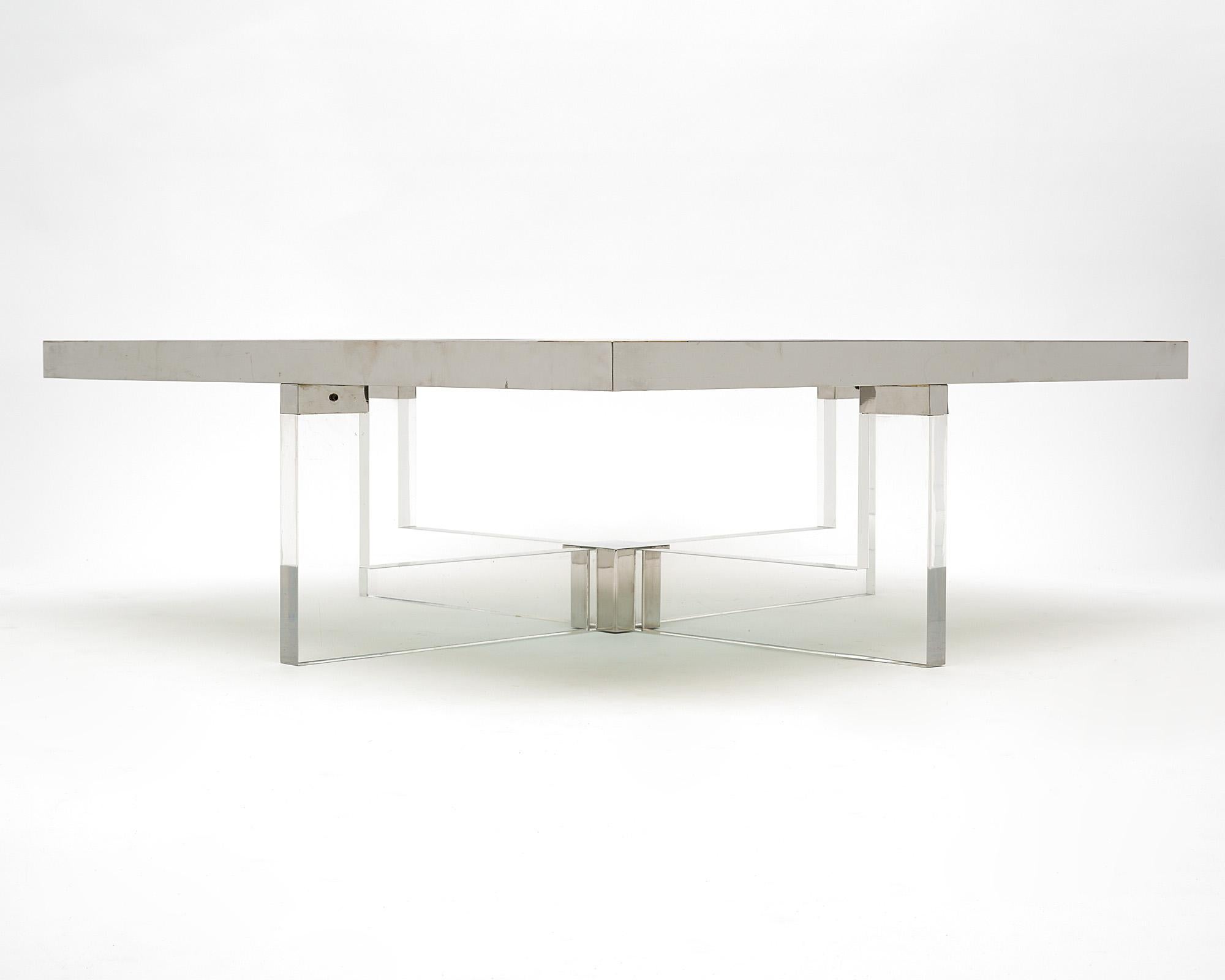 Table; Italian; made of Lucite; chromed steel; and brass. This table has a smoked glass top. This piece is by iconic designer Sandro Petti and originally came from the apartment of Zefferelli’s costume designer in Rome. Made for Angelo Metal Arte.