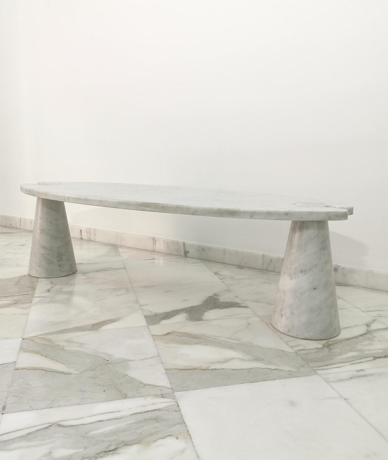 Rare coffee table designed by the renowned Italian designer Angelo Mangiarotti and produced by the Skipper company in Italy in the 1970s. The coffee table was made of Carrara marble with two conical legs where an oval-shaped top is placed.