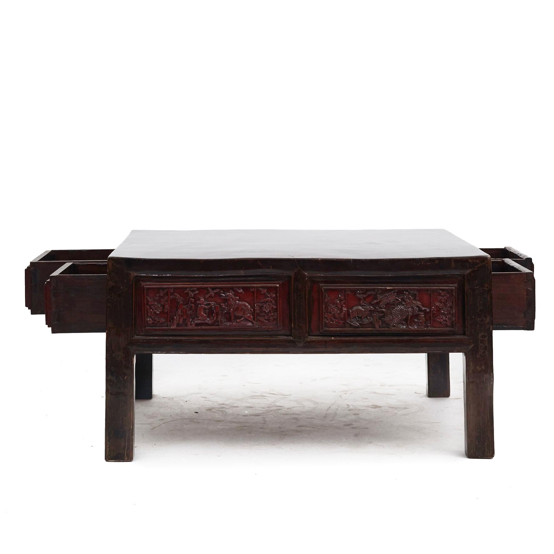 Coffee table made of rare iron wood. With red lacquer and image carving in the form of vases etc. made in high quality.
Original colors with beautiful age-related patina, highlighted by a clear lacquer surface finish.

Shanxi Province 1850-1870.