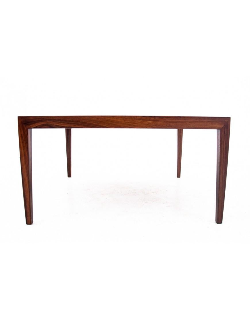 Low rosewood coffee table made in Denmark in the 1960s.

Beautiful natural wood with unique grain. Minimalist design will fit perfectly into contemporary interiors.

Very good condition, after professional renovation. The wood has been cleaned and