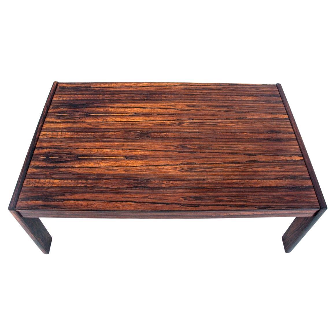 Coffee table made in Denmark in the 1960s.

Minimalist, timeless design will work great in modern, contemporary interiors. The whole veneered with beautifully grained rosewood.

The table has been renovated, the wood has been cleaned and finished