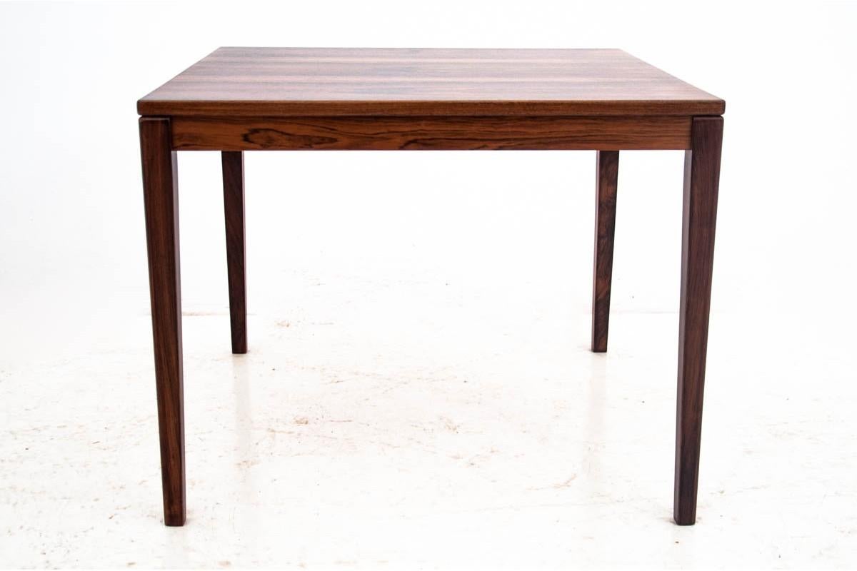Coffee table made in Denmark in the 1960s.

Minimalist, timeless design will work great in contemporary interiors. The furniture is made of rosewood. The table has been renovated, the wood has been cleaned and finished with a durable semi-matt