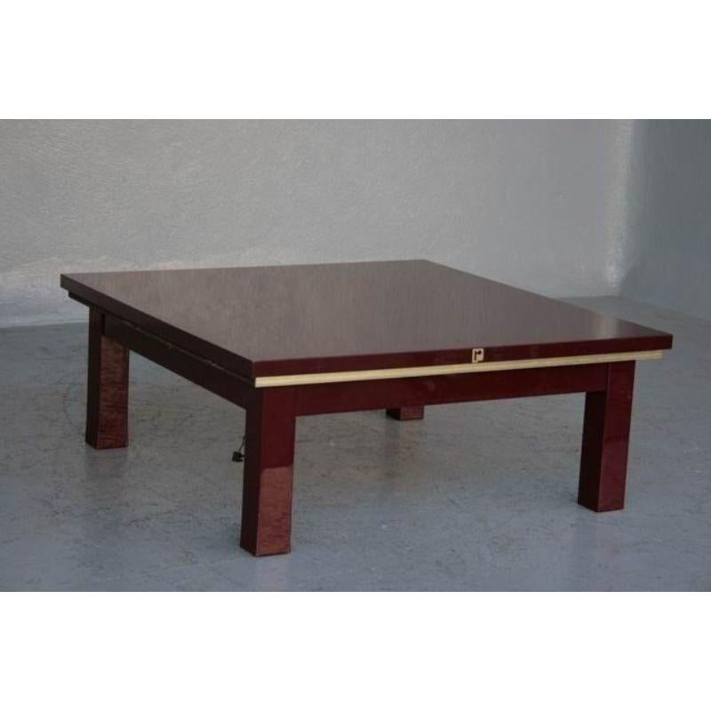 1970 Paco Rabannes design coffee table in burgundy lacquer, height dimension 39 cm for a square top size 96 x 96 cm.

Style: Vintage 1970
Material: Lacquered wood
Artist: Paco Rabannes (born in 1934).