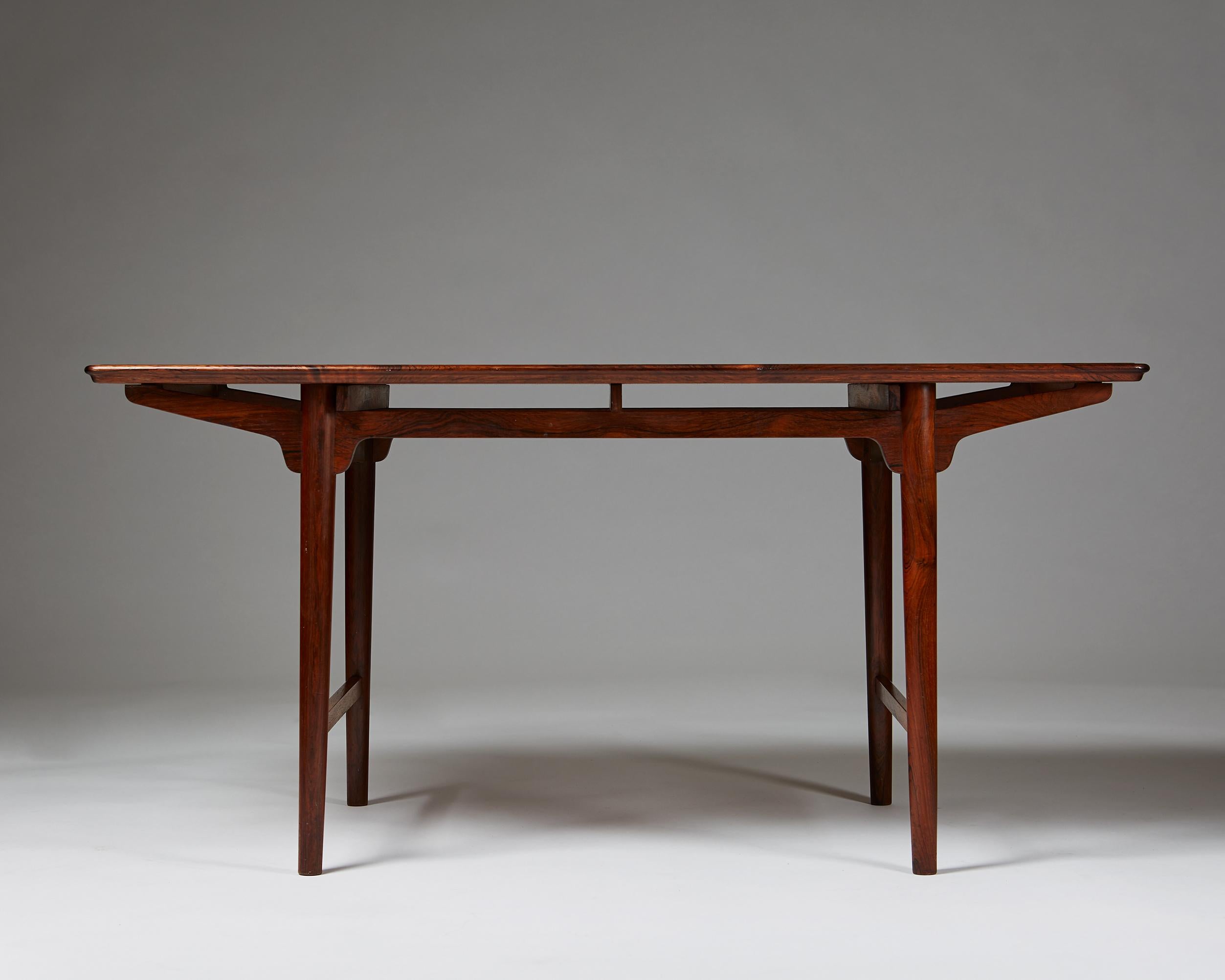 Coffee table designed by Frode Holm for Illums Bolighus,
Denmark. 1950's.

Rosewood.

Measurements:
H: 56 cm/ 22''
L: 121 cm/ 4'
W: 61 cm/ 24''