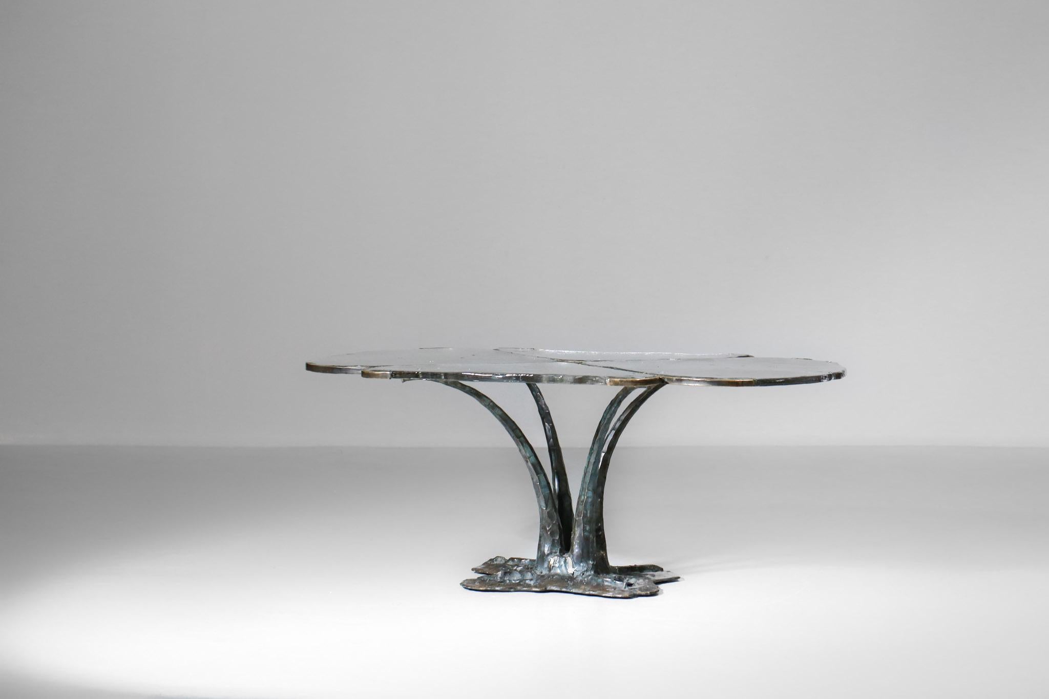 Beautiful coffee table by the German artist Lothar Klute in the shape of a flower. 
Solid bronze frame and base and petal-shaped cast glass top.
The artist's signature is on the frame.