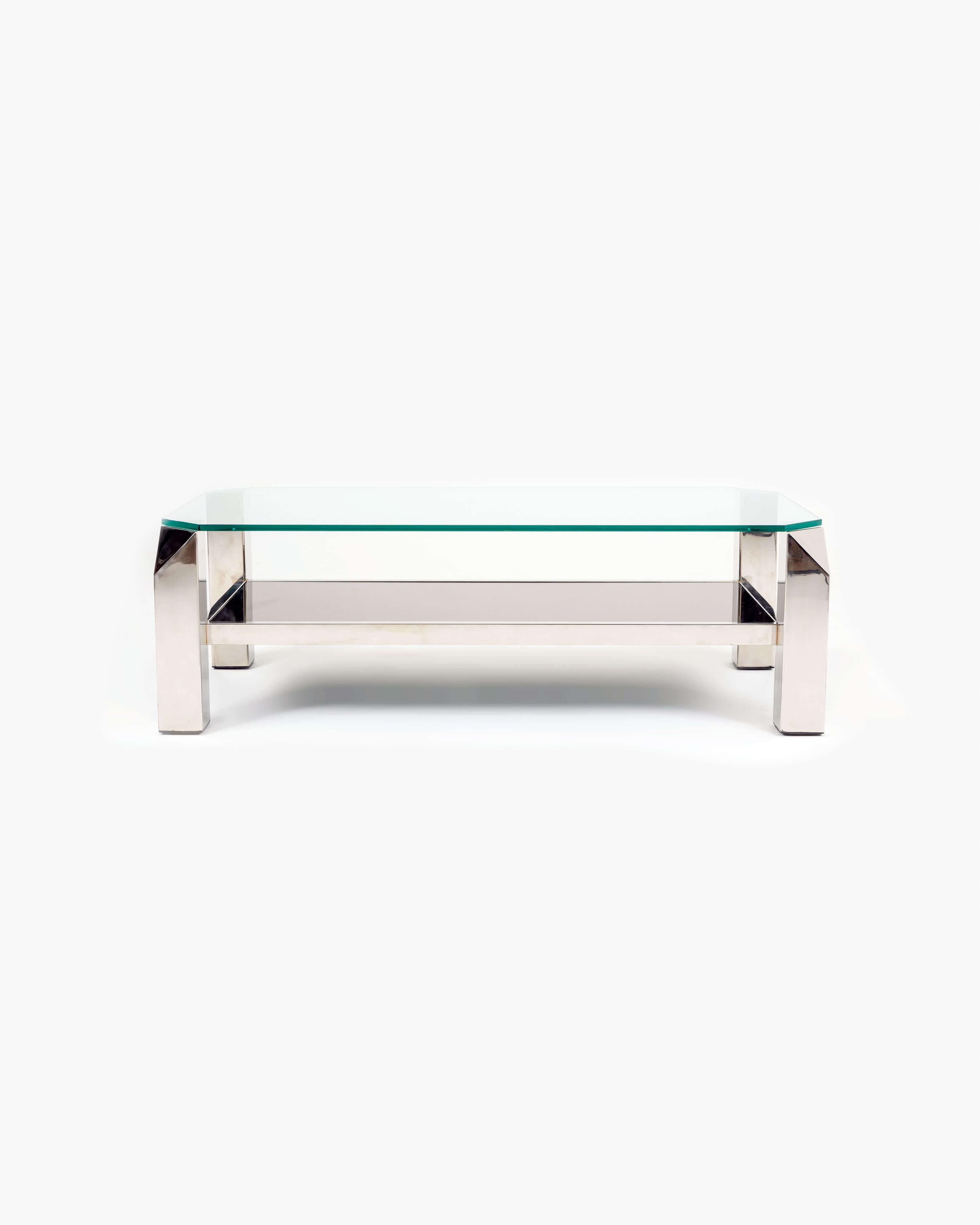 Introducing the exquisite Belgo Chrom Coffee Table: a stunning piece crafted with precision and style. This geometric two-tiered coffee table, originating from Belgium in the mid-20th century, exudes timeless elegance. Meticulously refinished to its