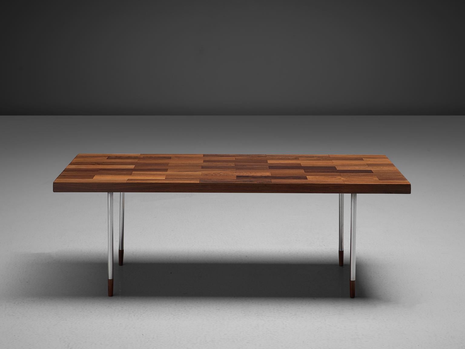 Fristho, coffee table, rosewood and stainless steel, the Netherlands, 1960s.

The rectangular top is made with rosewood veneer slats, in wonderful different tones. The warm expression of the basic top beautifully contrasts to the thin tubular