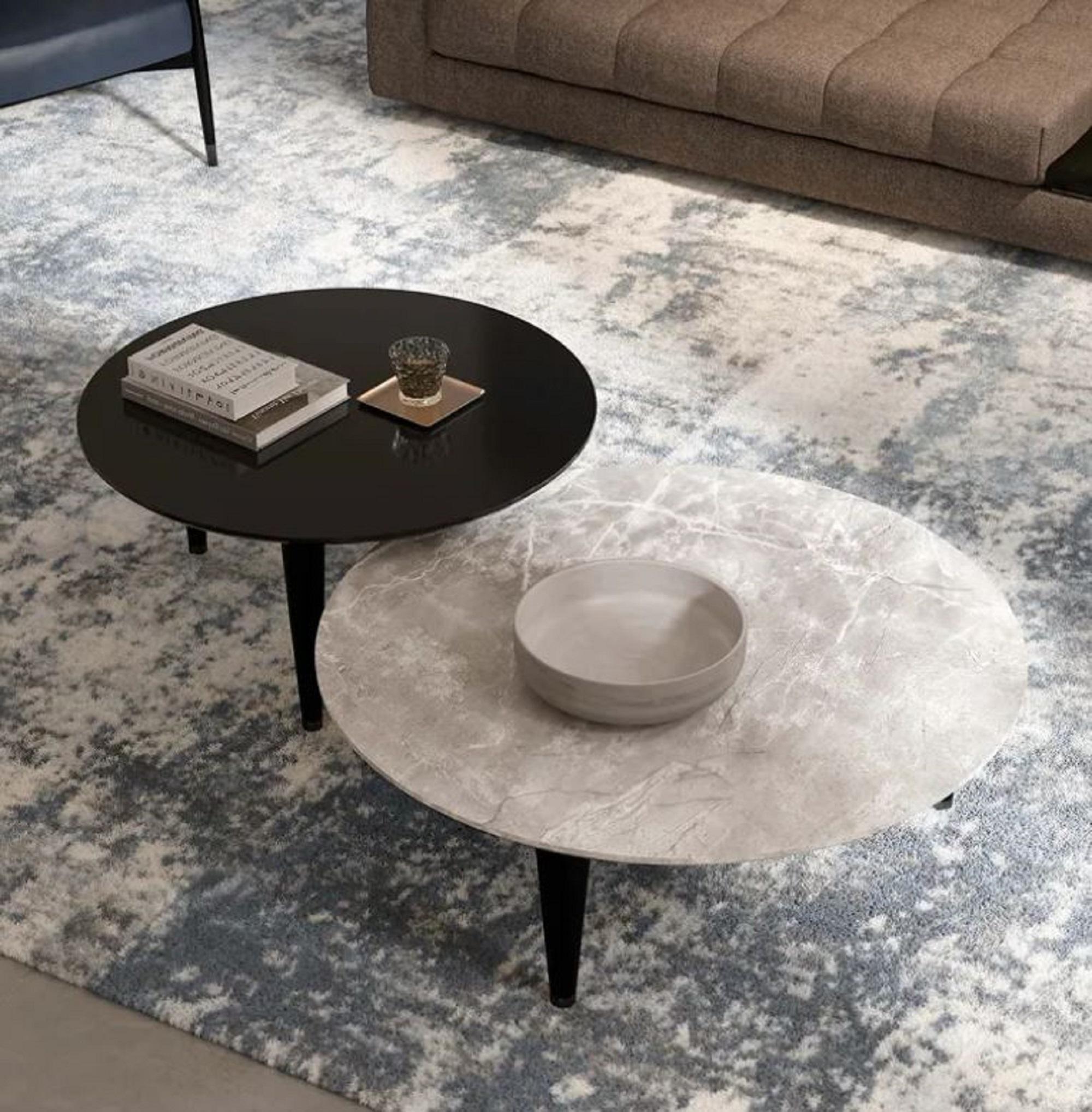 The Next Level coffee table by Malerba sounds truly impressive. It is available in three sizes and can be ordered with either a marble or wood top. The legs are made of matte black lacquered wood, complemented by metal feet, giving the table an