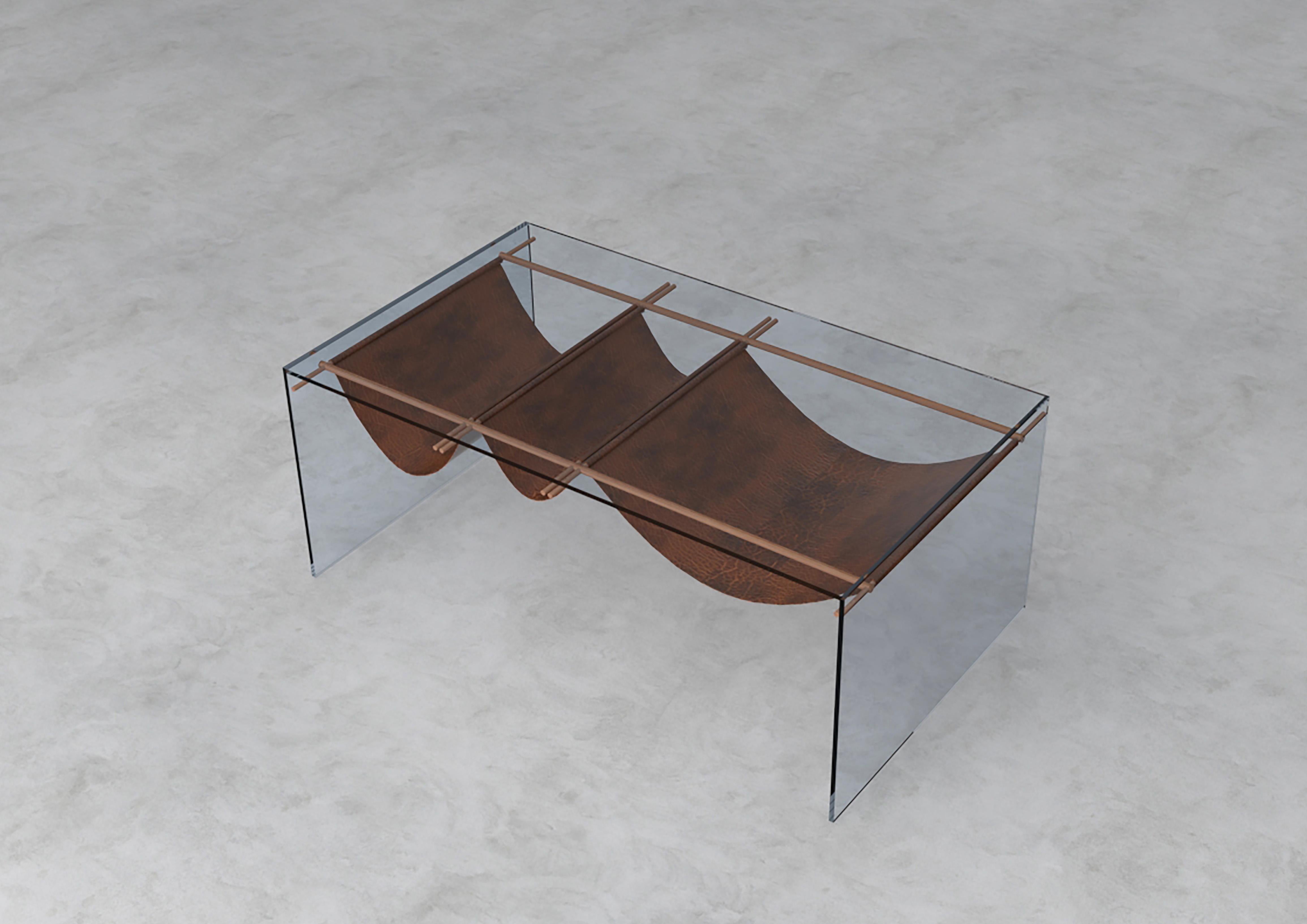 Coffee table is produced rom the harmony of 8mm thick tempered smoked glass and 6mm thick polished wooden structure and faux leather.