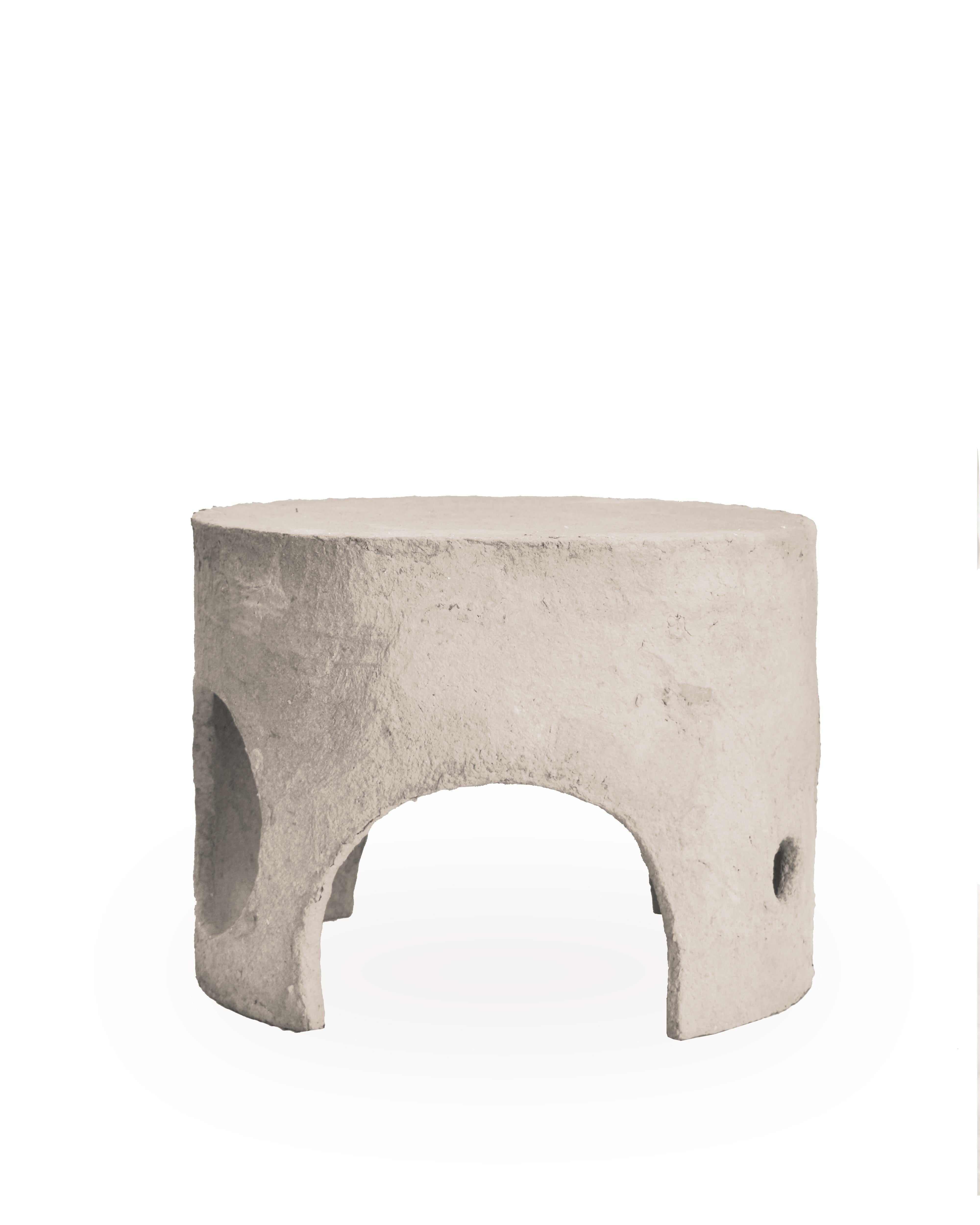 The coffee table is made entirely from 100% recycled paper, and it stands out due to its unique design characterized by holes that catch the eye from every angle. Inspired by the works of Gordon Matta-Clark, this piece aims to alter the perception