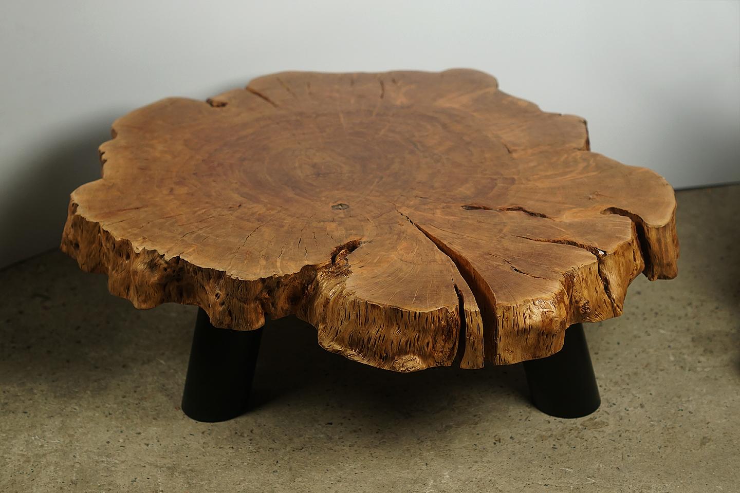 Coffee table, Inhouse production (Designer Cocomaster)

Beautiful organic lychee wood coffee table with stunning erosion detail and legs made of iron coloured black. 
Oiling the root gives its special unique finish.