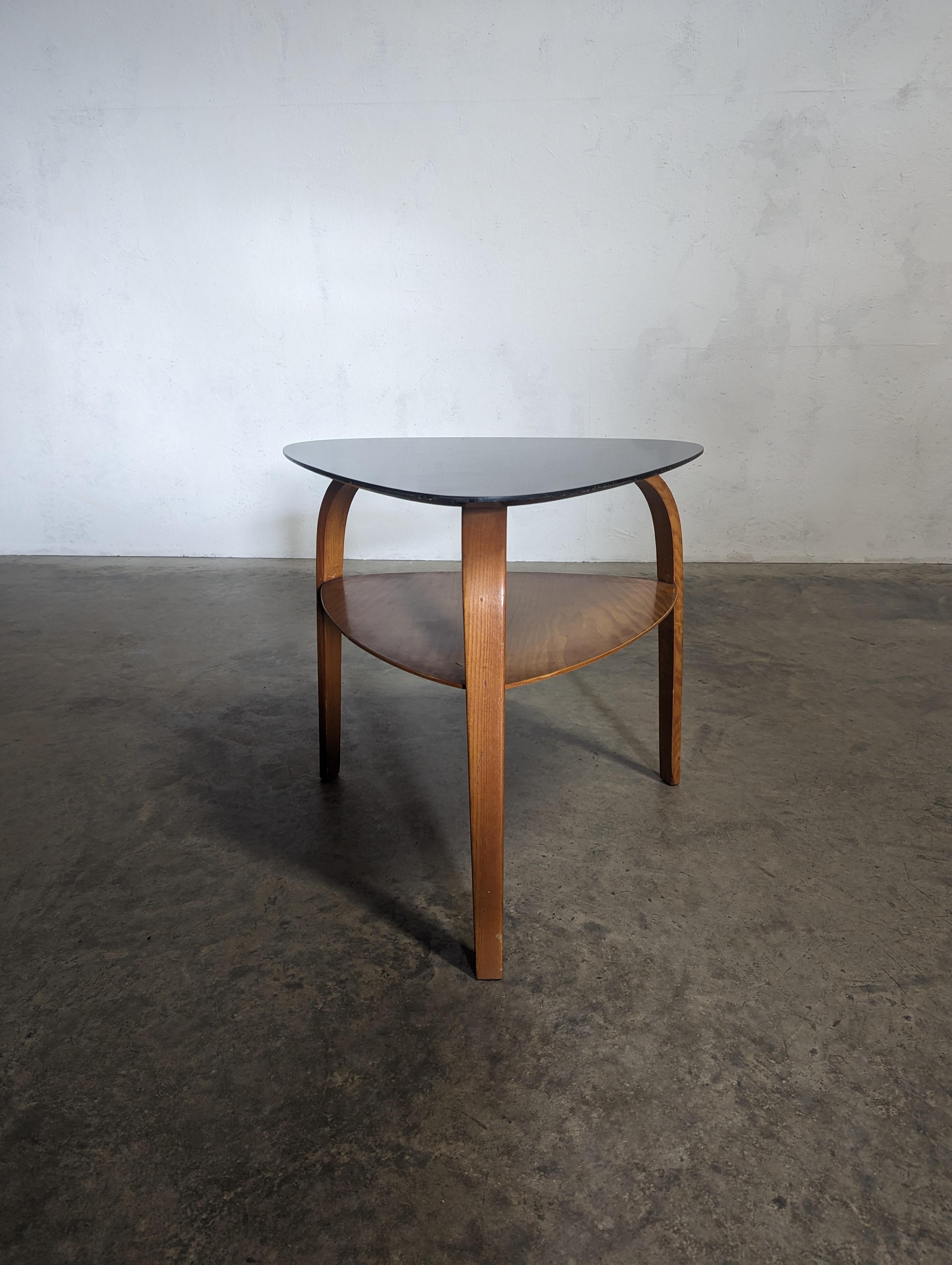 Coffee table, from the Bow Wood line circa 1950 by french company Steiner.
Top is  in black 