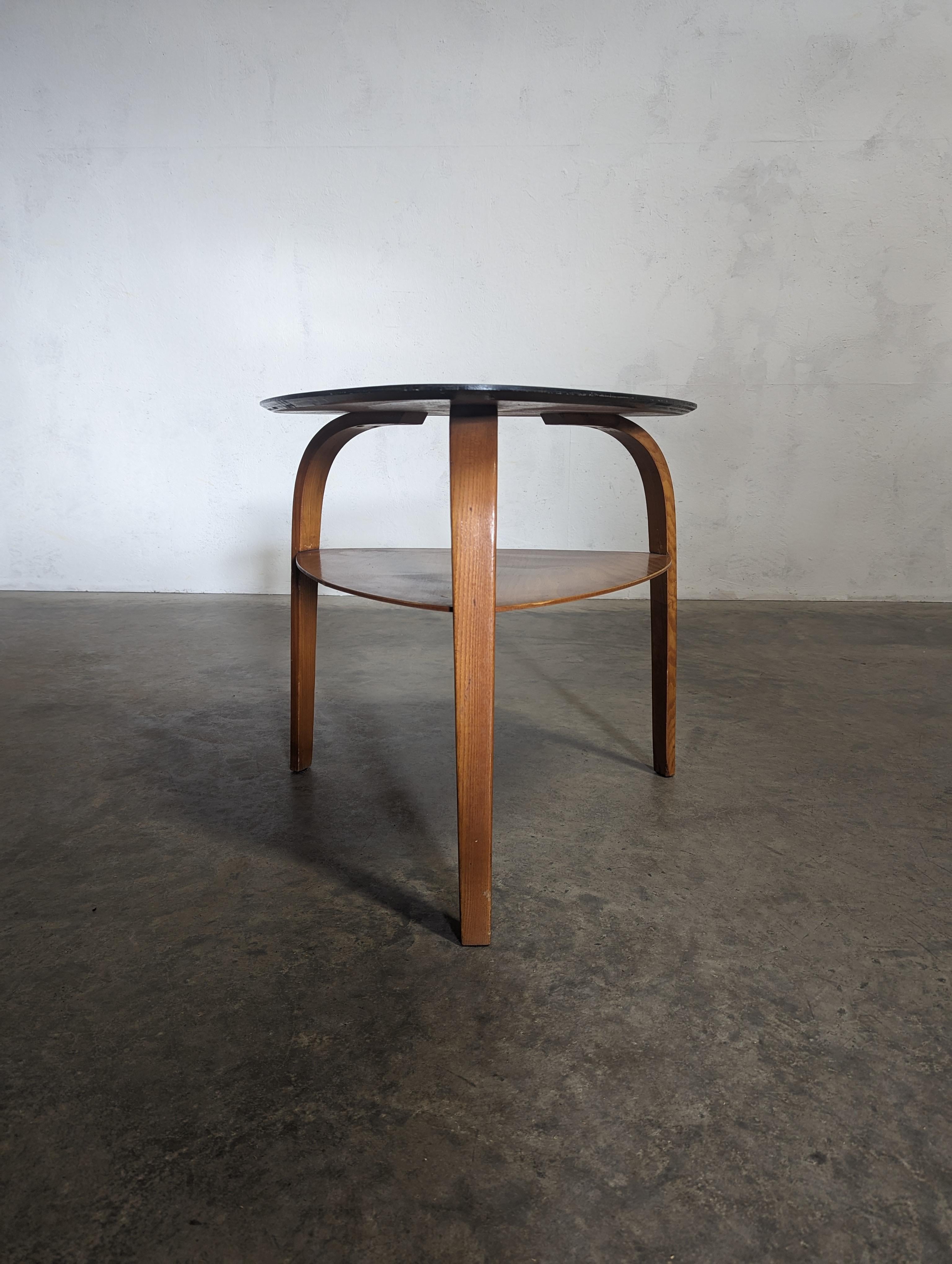 Modern coffee table, from the Bow Wood line circa 1950 by french company Steiner For Sale
