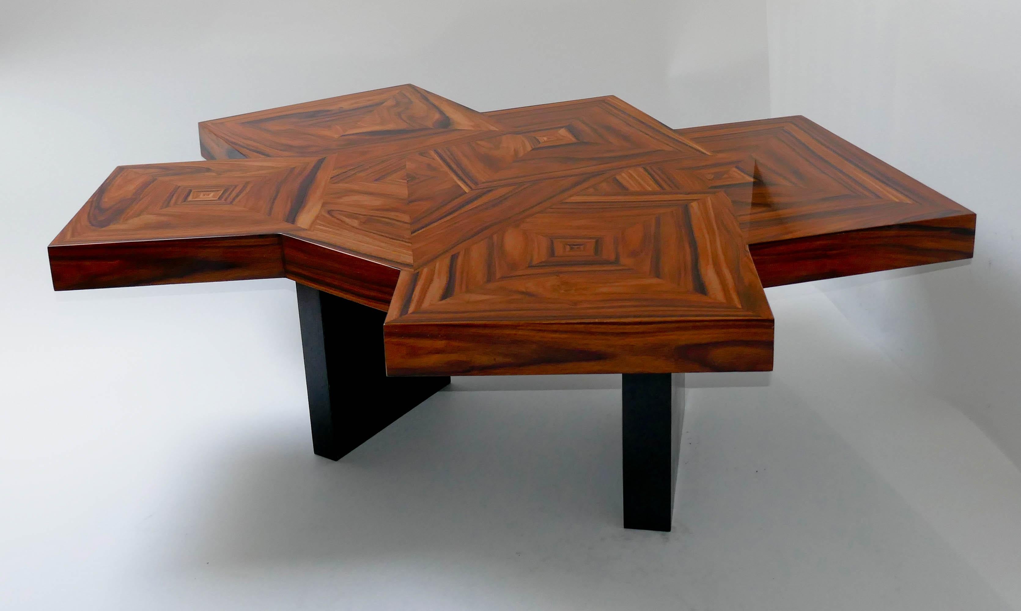 Coffee table in marquetery of Santos wood. The legs are in black tinted oak.
 