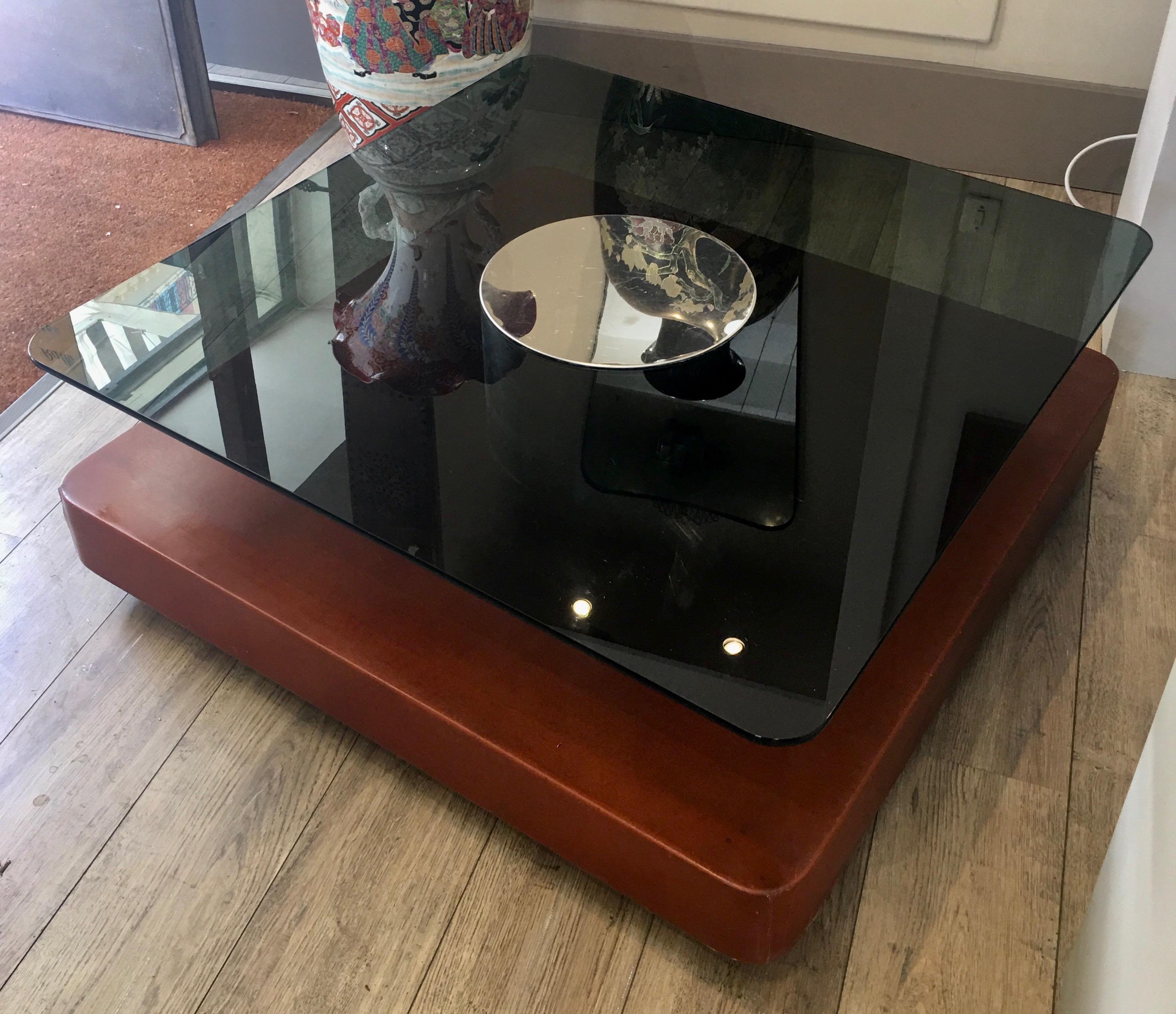 Square smoked glass top table, chrome cylinder, burgundy faux leather coffee table, castors, made in Italy, 1970.